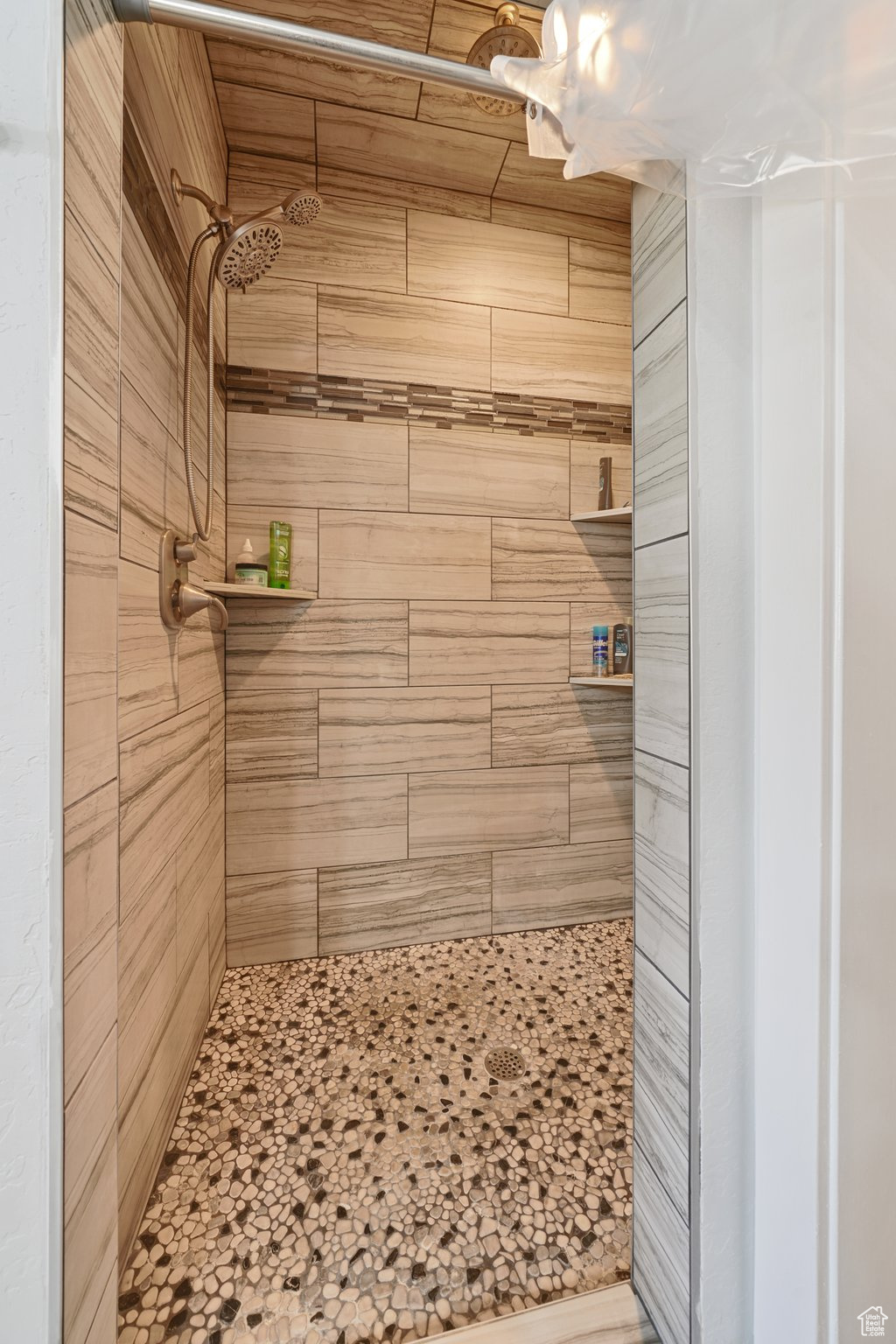 Full bath with a tile shower