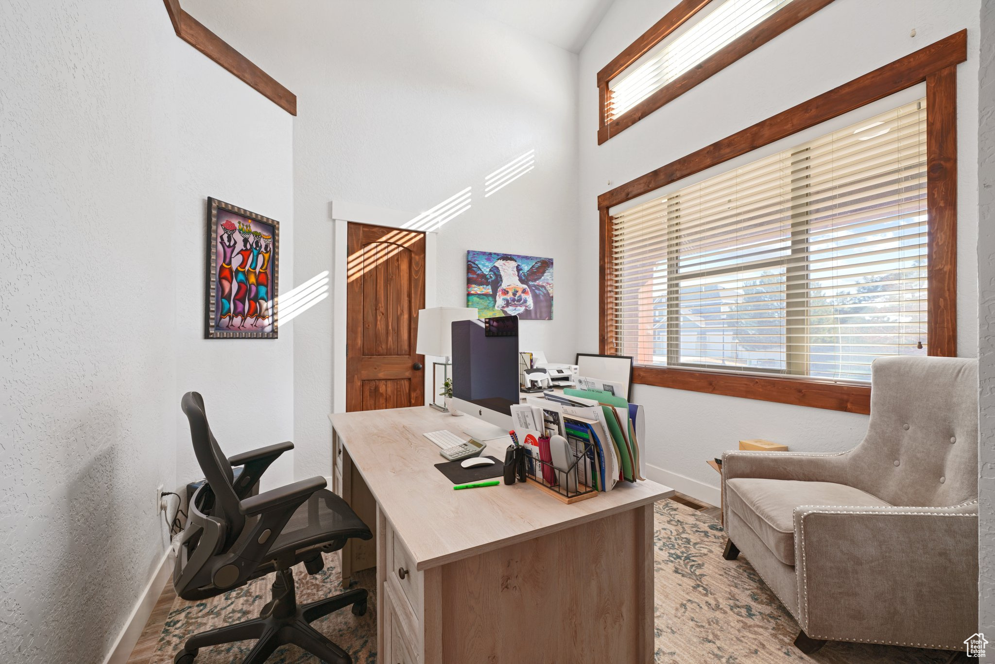 Home office with baseboards and light wood finished floors