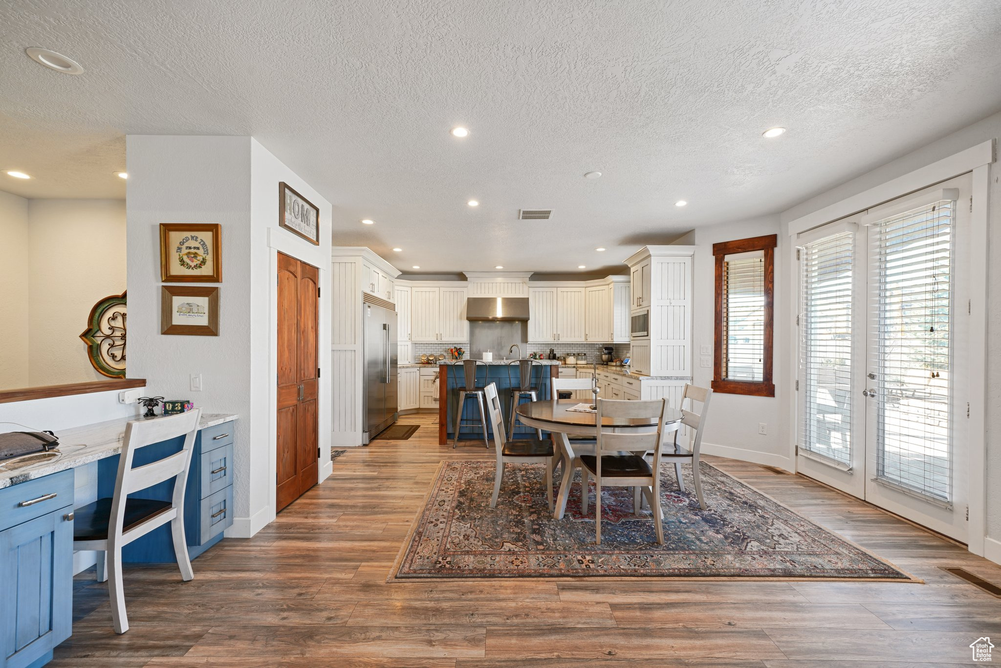 Dining space featuring recessed lighting, wood finished floors, visible vents, and baseboards