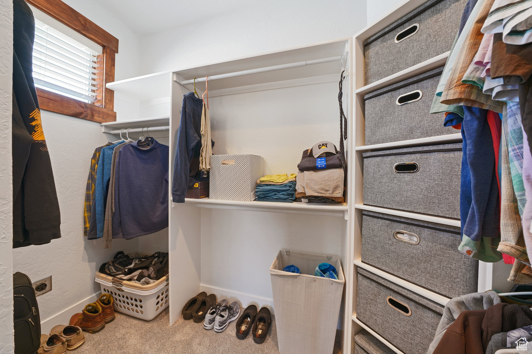 Walk in closet featuring carpet flooring