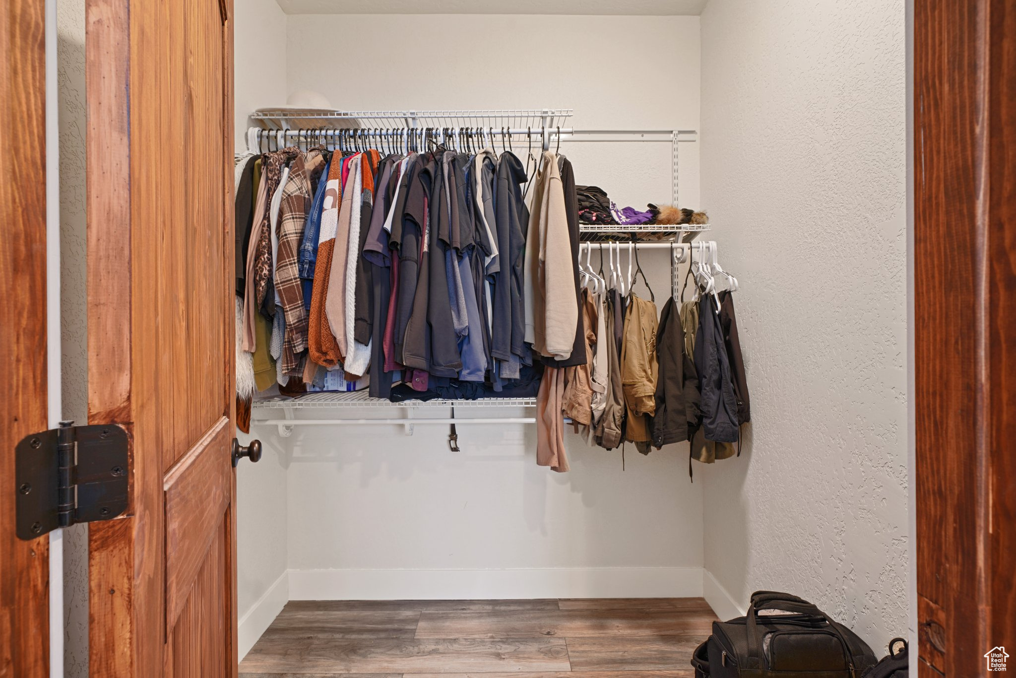 Spacious closet with wood finished floors