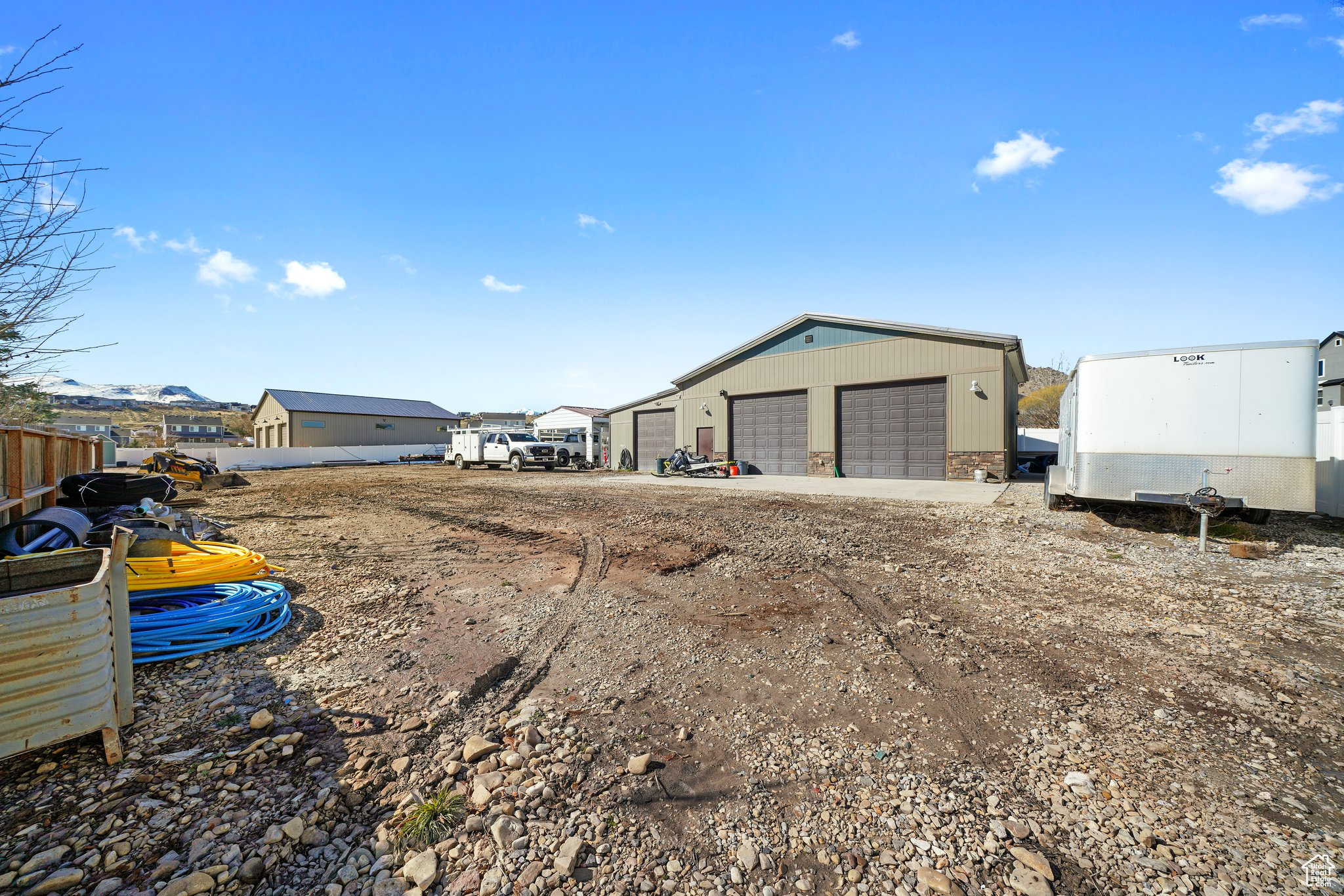 View of yard with a detached garage and an outdoor structure