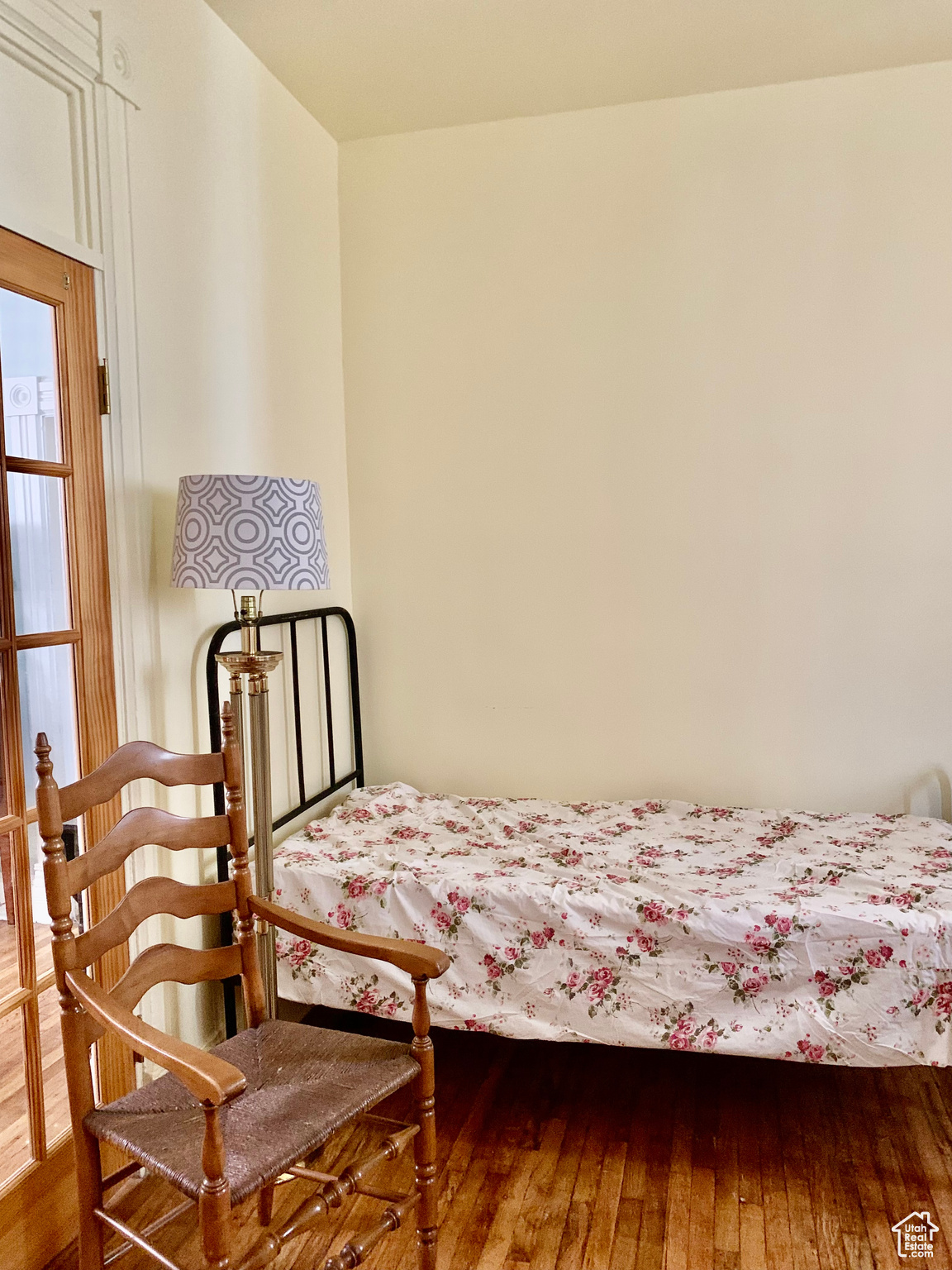 Bedroom with hardwood / wood-style floors