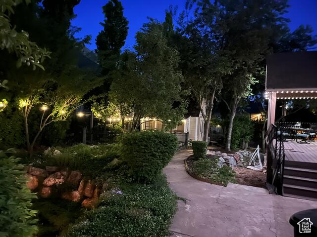 Yard at twilight featuring a deck