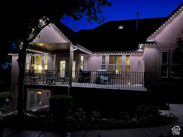 Back of house at night featuring jelly fish lighting