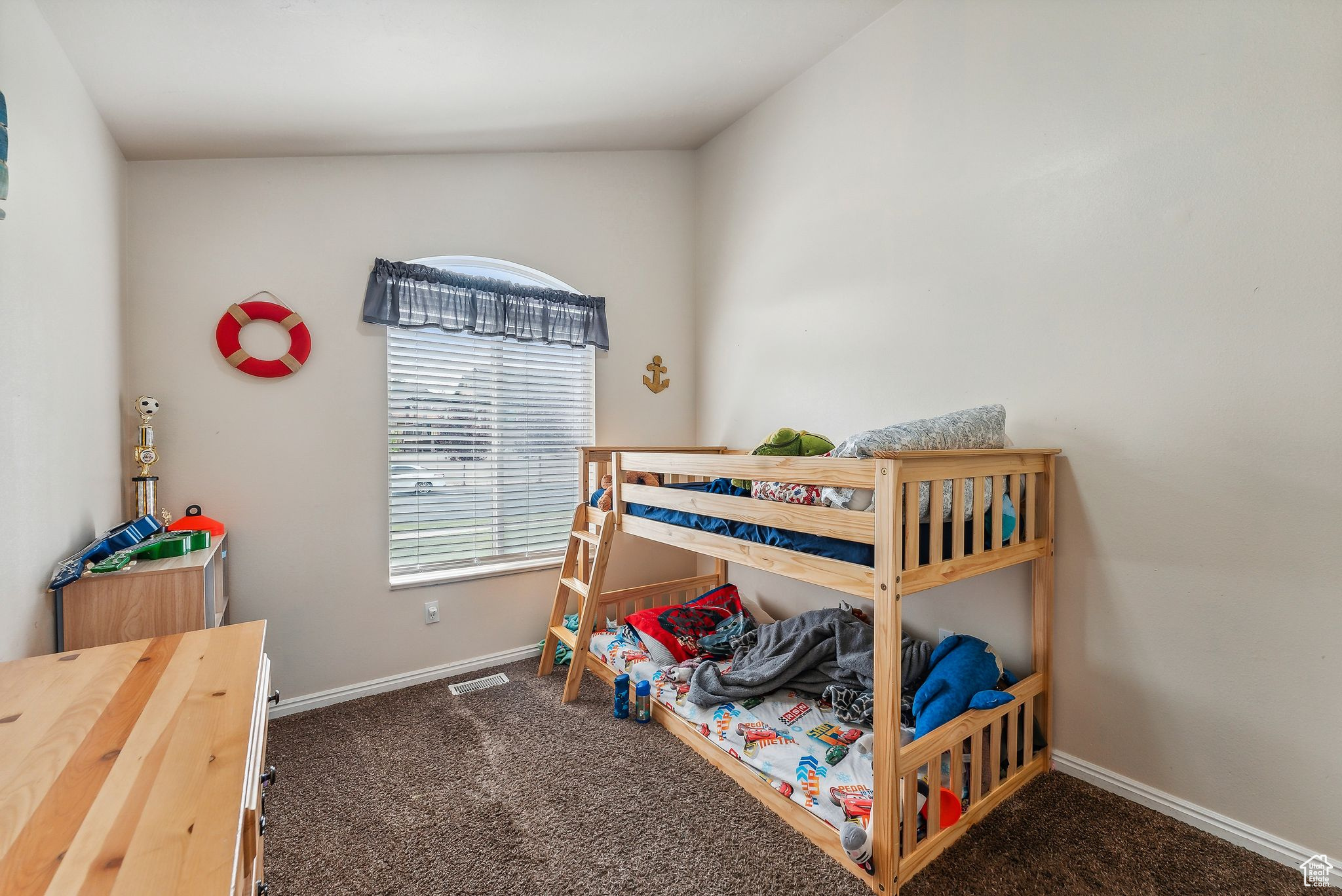 Carpeted bedroom with baseboards