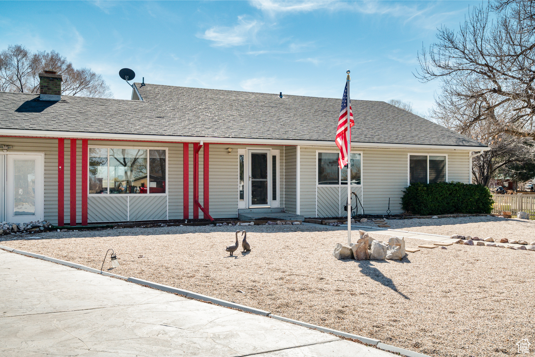 Ranch-style home featuring a a newly shingled roof and xeriscaped yard