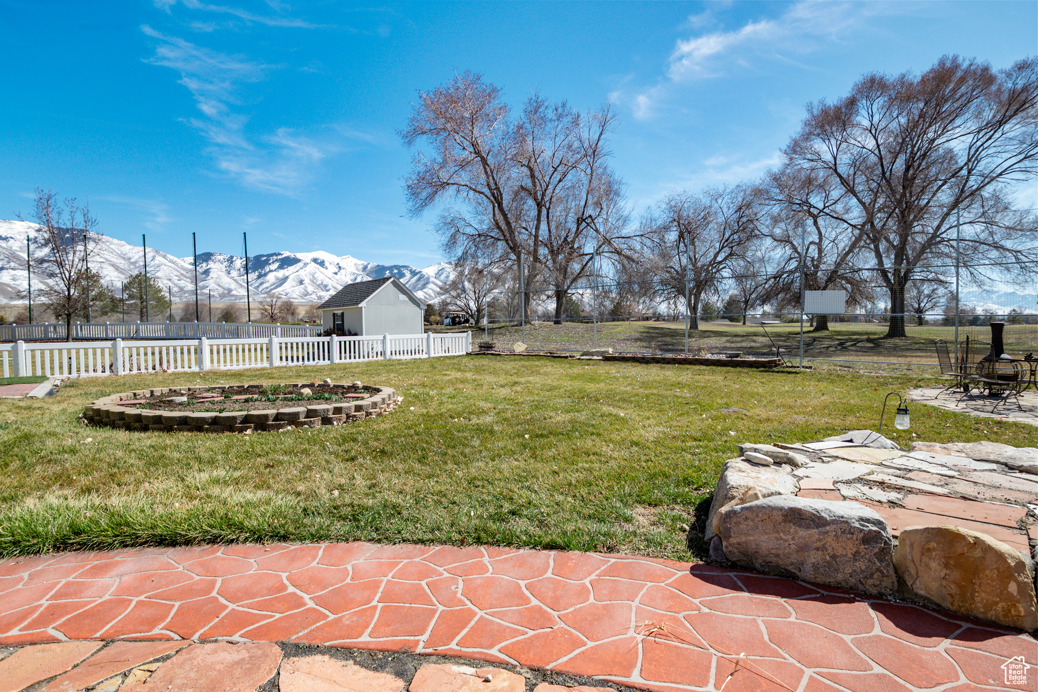 View of yard featuring a mountain view & a patio