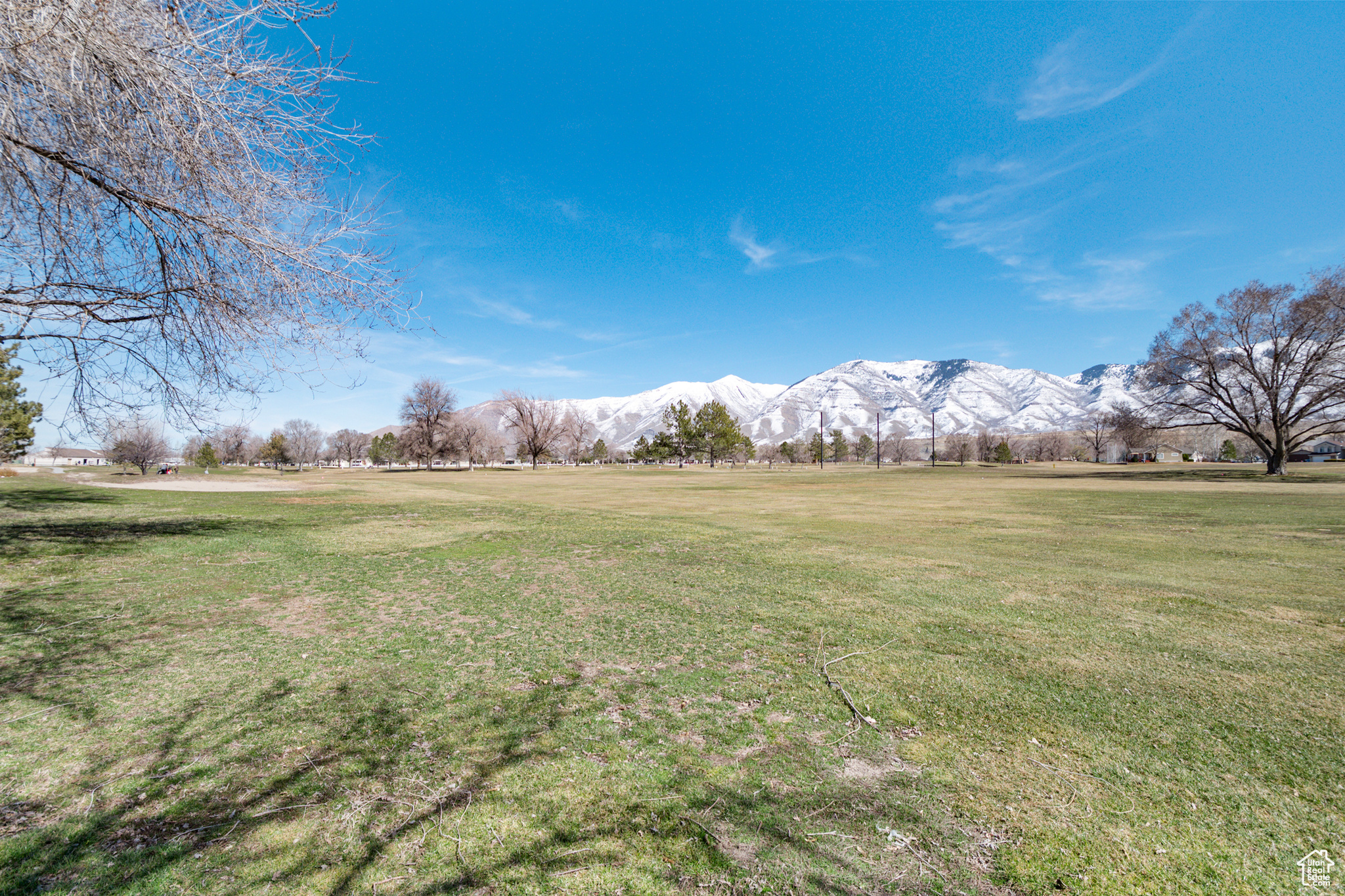 View of yard and golf course with  a mountain view