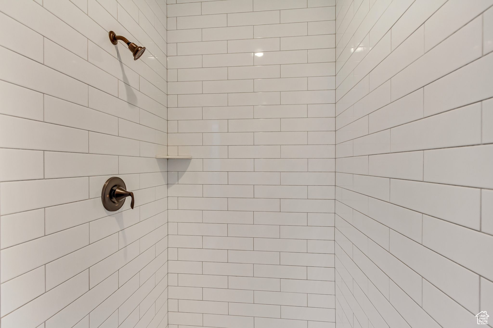 Main Floor Primary Bathroom with dual head tiled shower.
