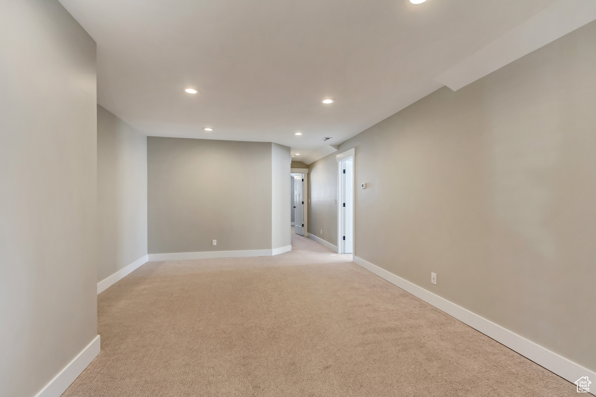 Upstairs loft / family room, leading to 2 additional bedrooms and a 3/4 bath.