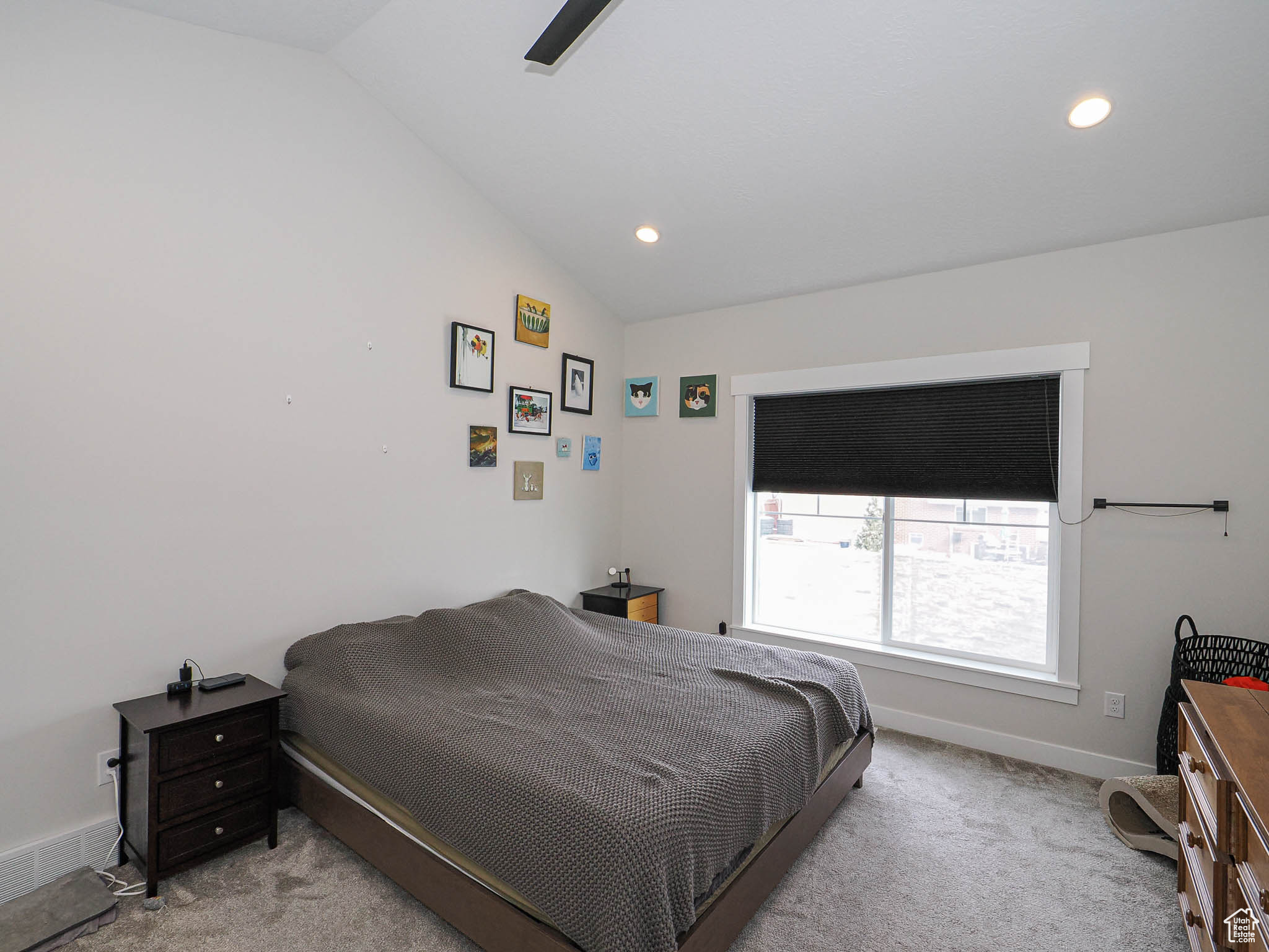 Bedroom featuring lofted ceiling, light carpet, baseboards, and recessed lighting