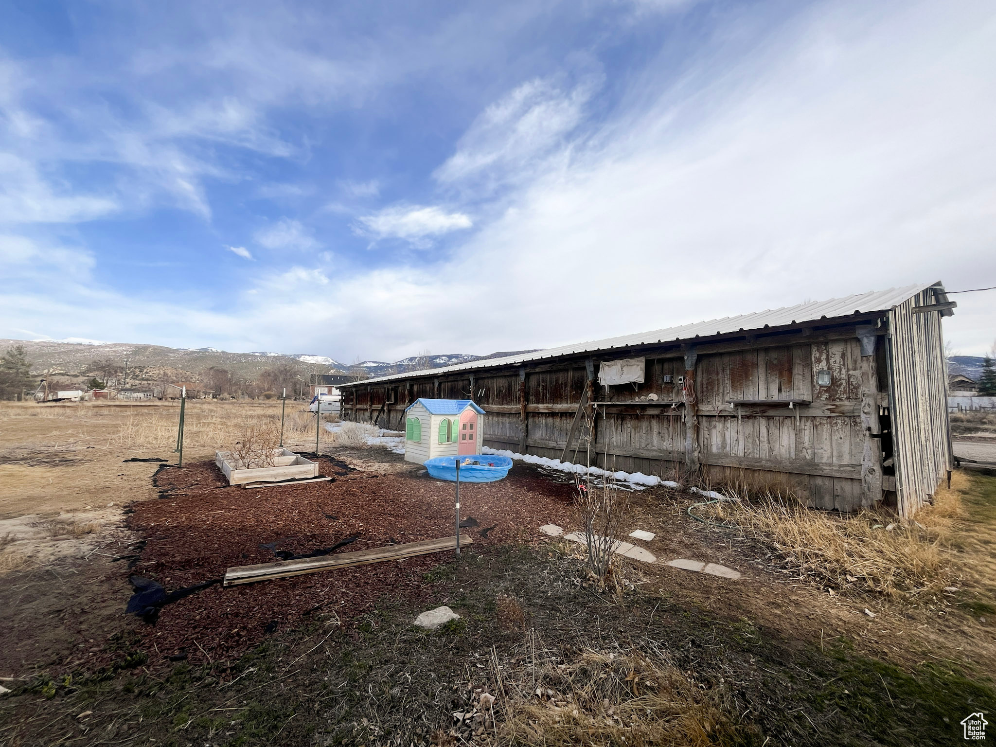 View of yard featuring an outbuilding and exterior structure