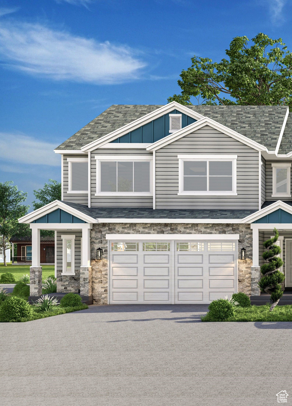 View of front facade with stone siding, an attached garage, board and batten siding, and driveway