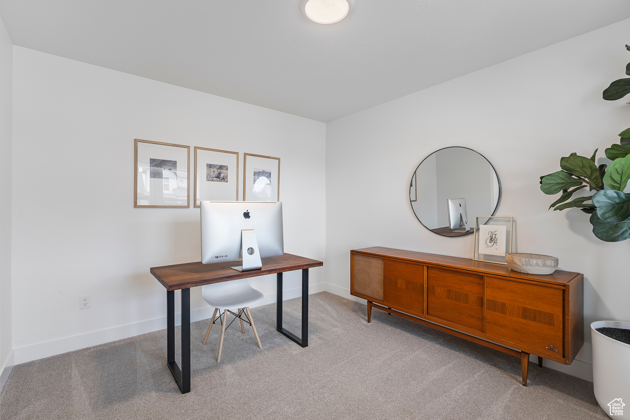 Office area with carpet and baseboards