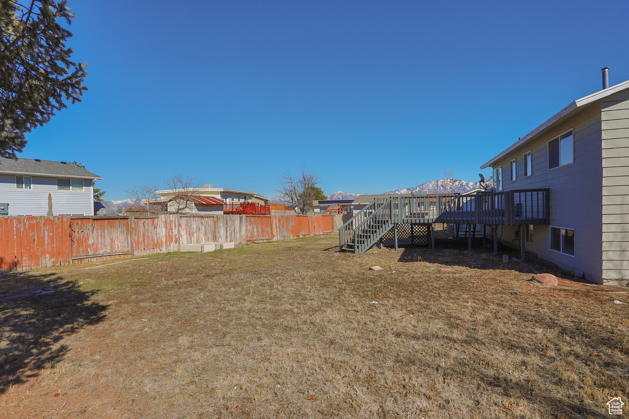 View of yard with a deck and a fenced backyard