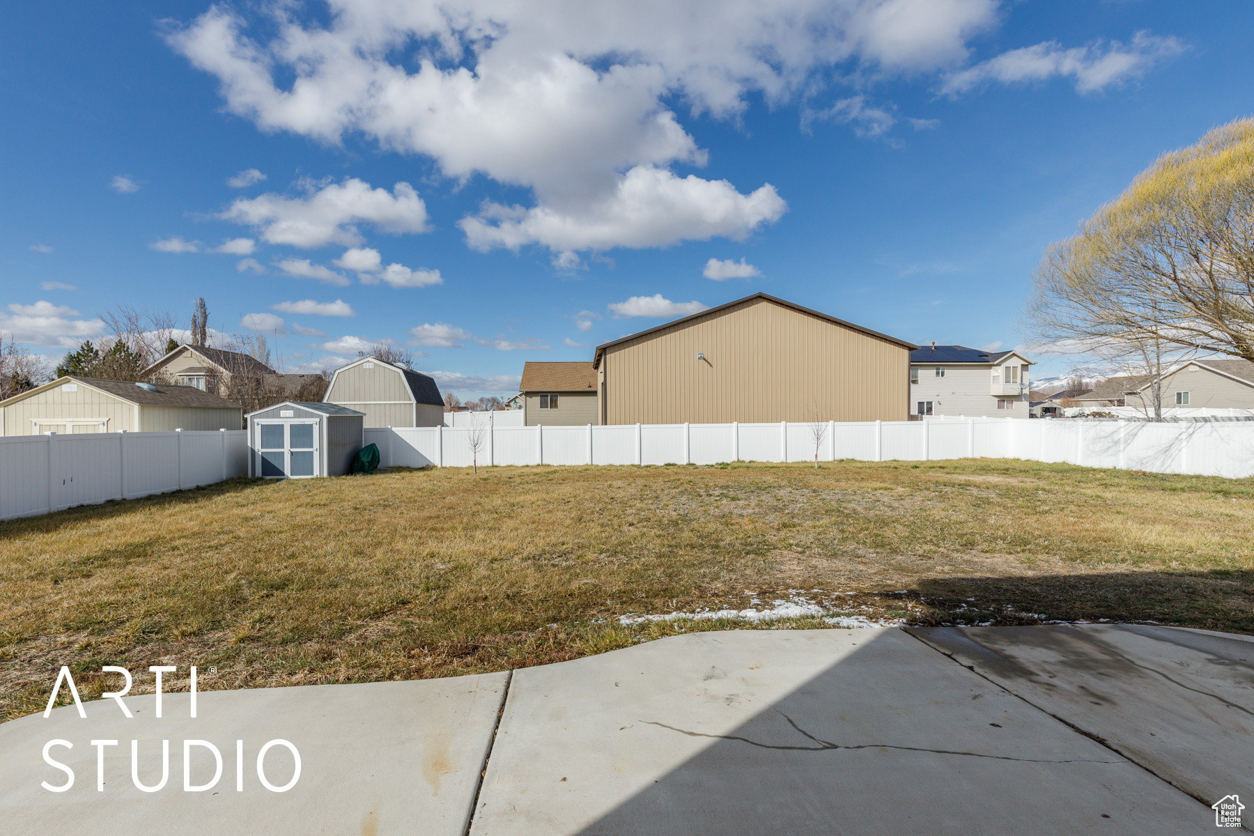 View of yard with an outbuilding, a fenced backyard, a shed, and a patio