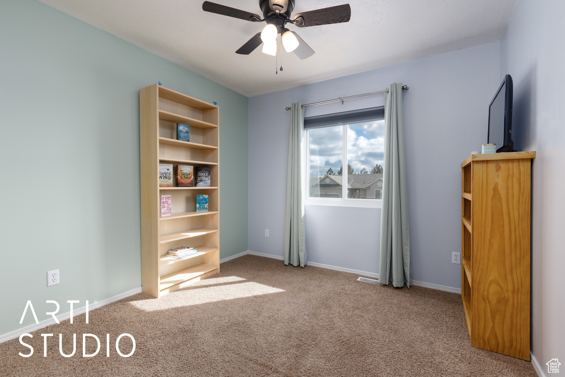 Unfurnished bedroom with carpet, baseboards, and ceiling fan