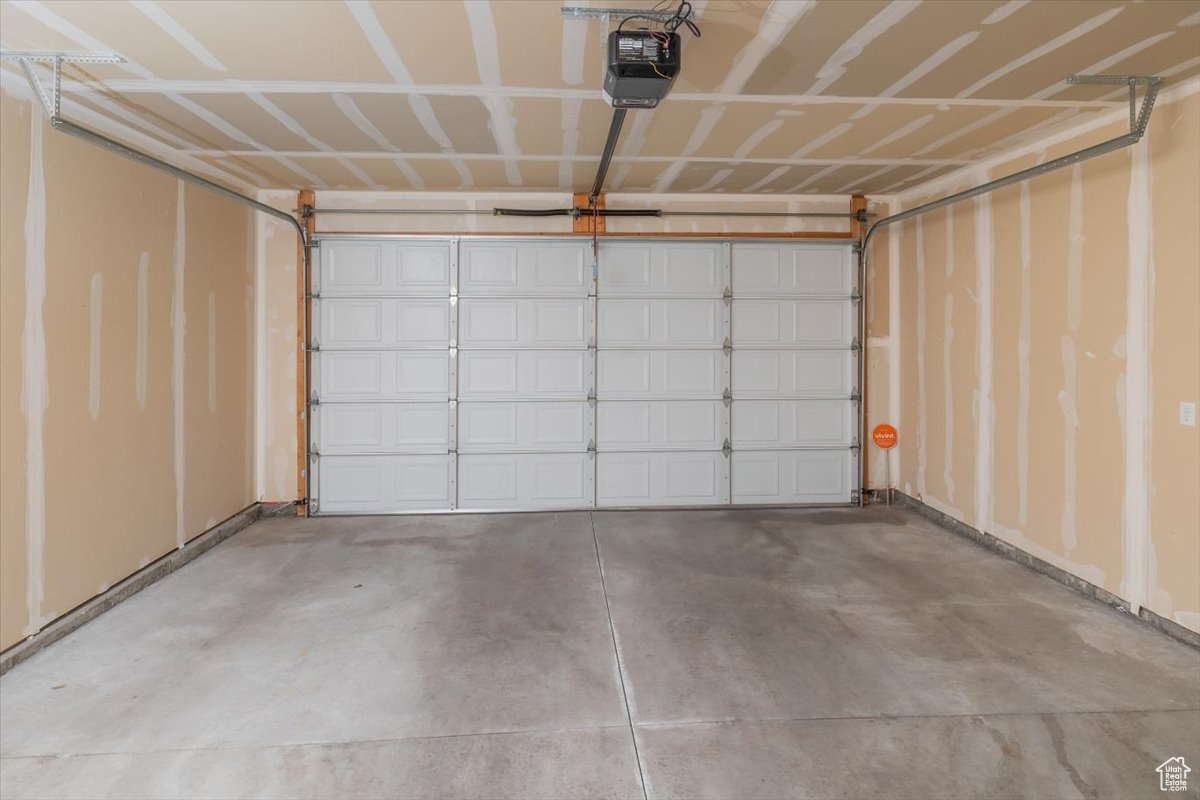 Garage featuring a garage door opener