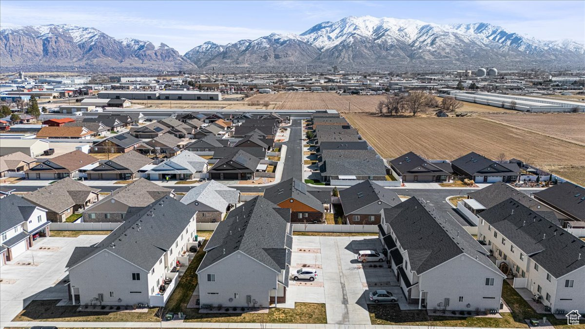 Drone / aerial view with a residential view and a mountain view