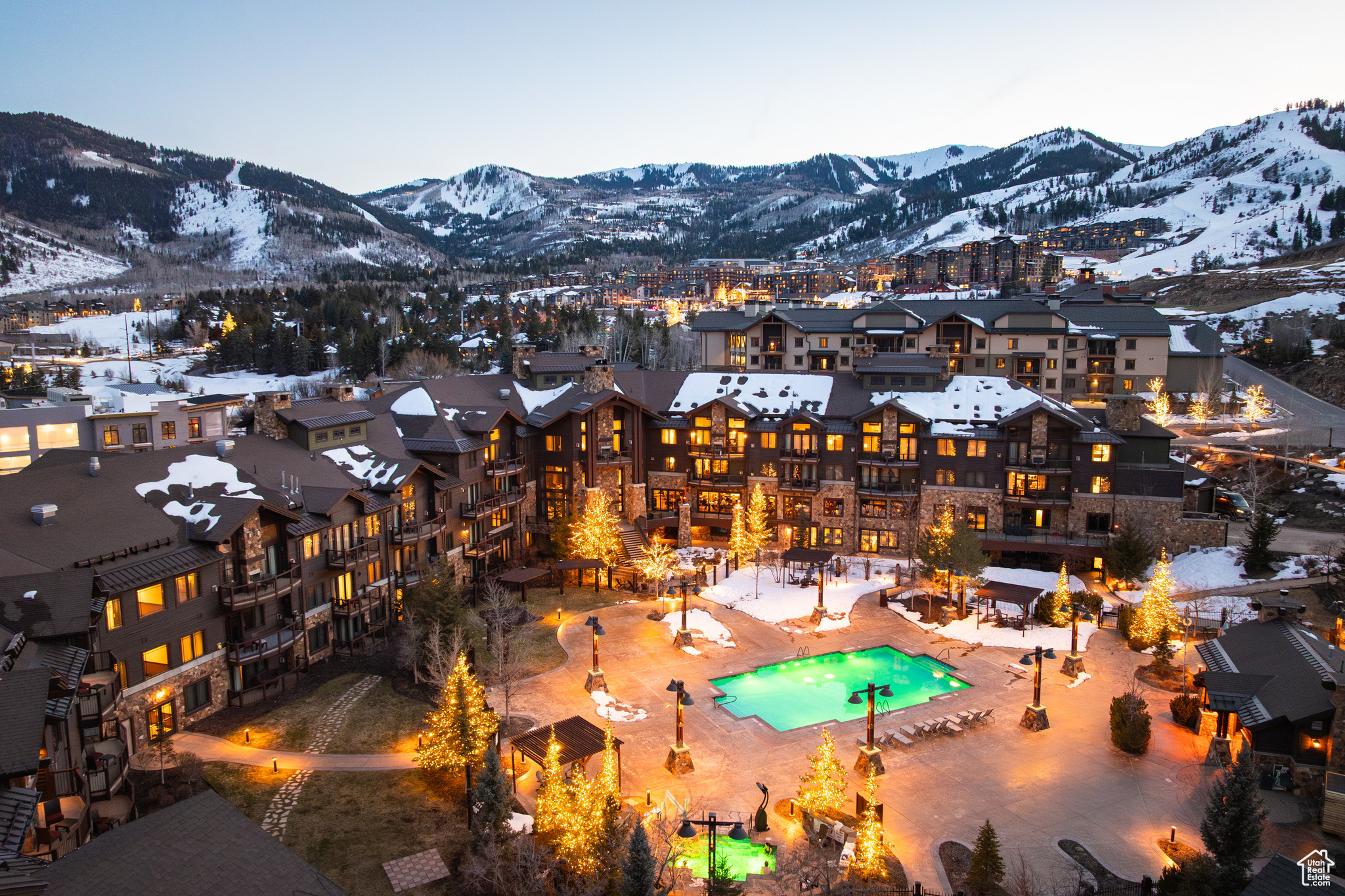 Snowy aerial view with a mountain view and a residential view