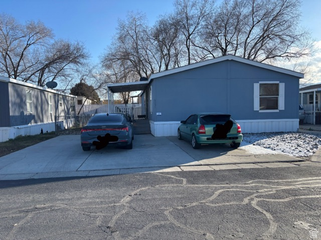 View of front of property featuring an attached carport