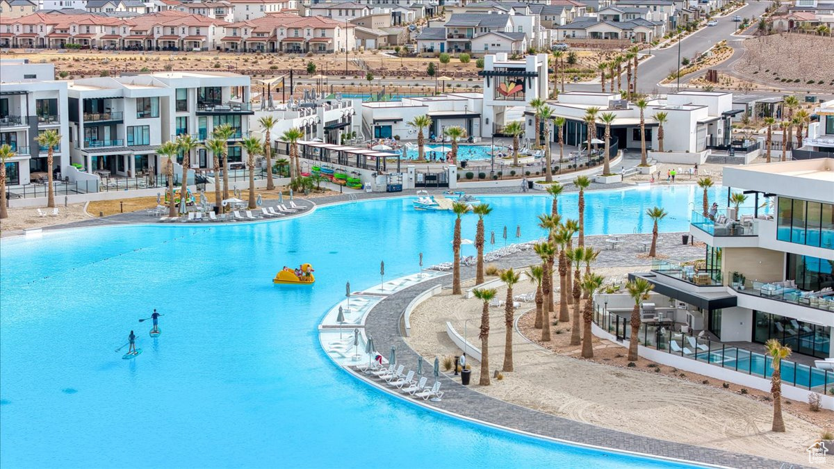 View of pool featuring a residential view and a water slide