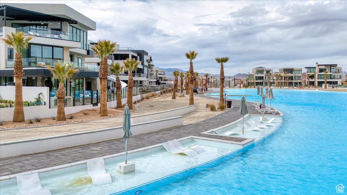 View of pool with a residential view