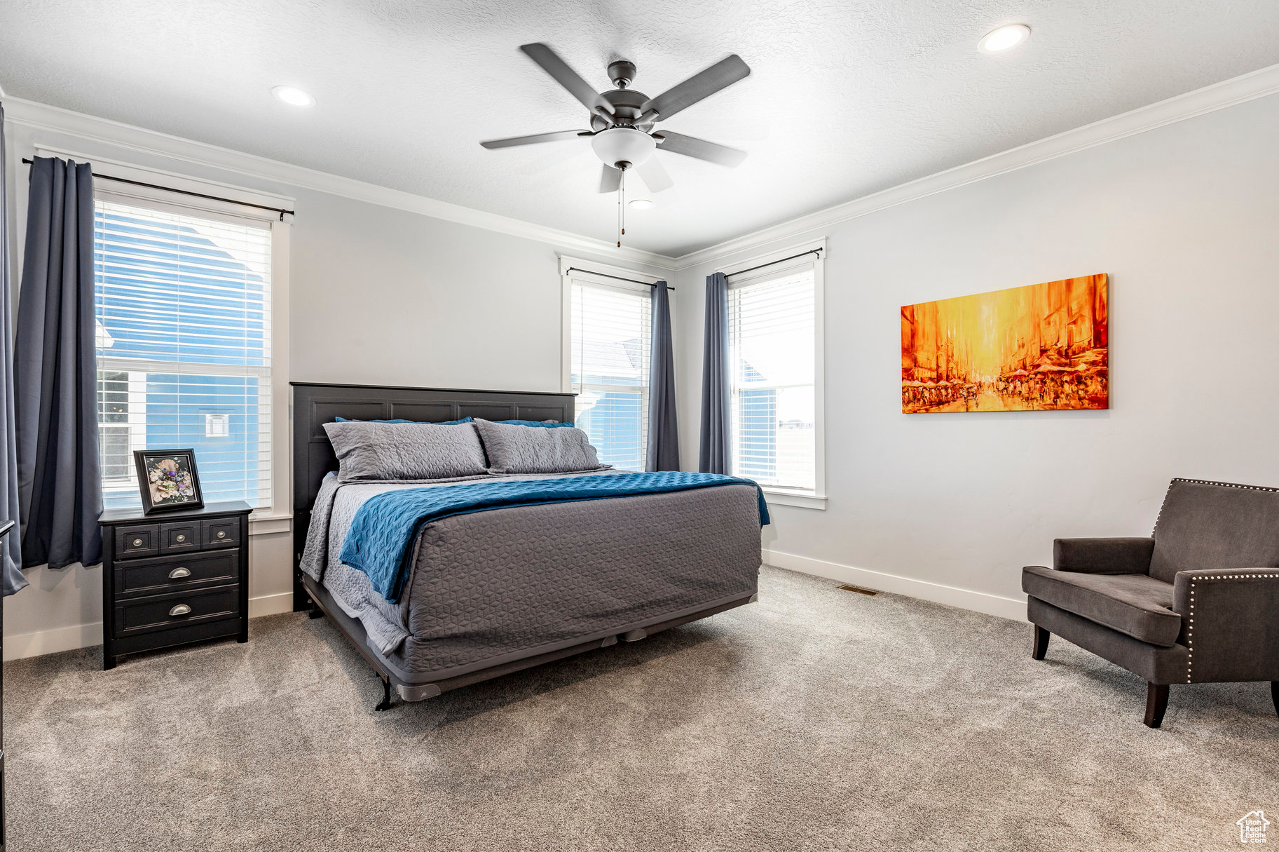 Bedroom featuring ceiling fan, carpet flooring, baseboards, and ornamental molding