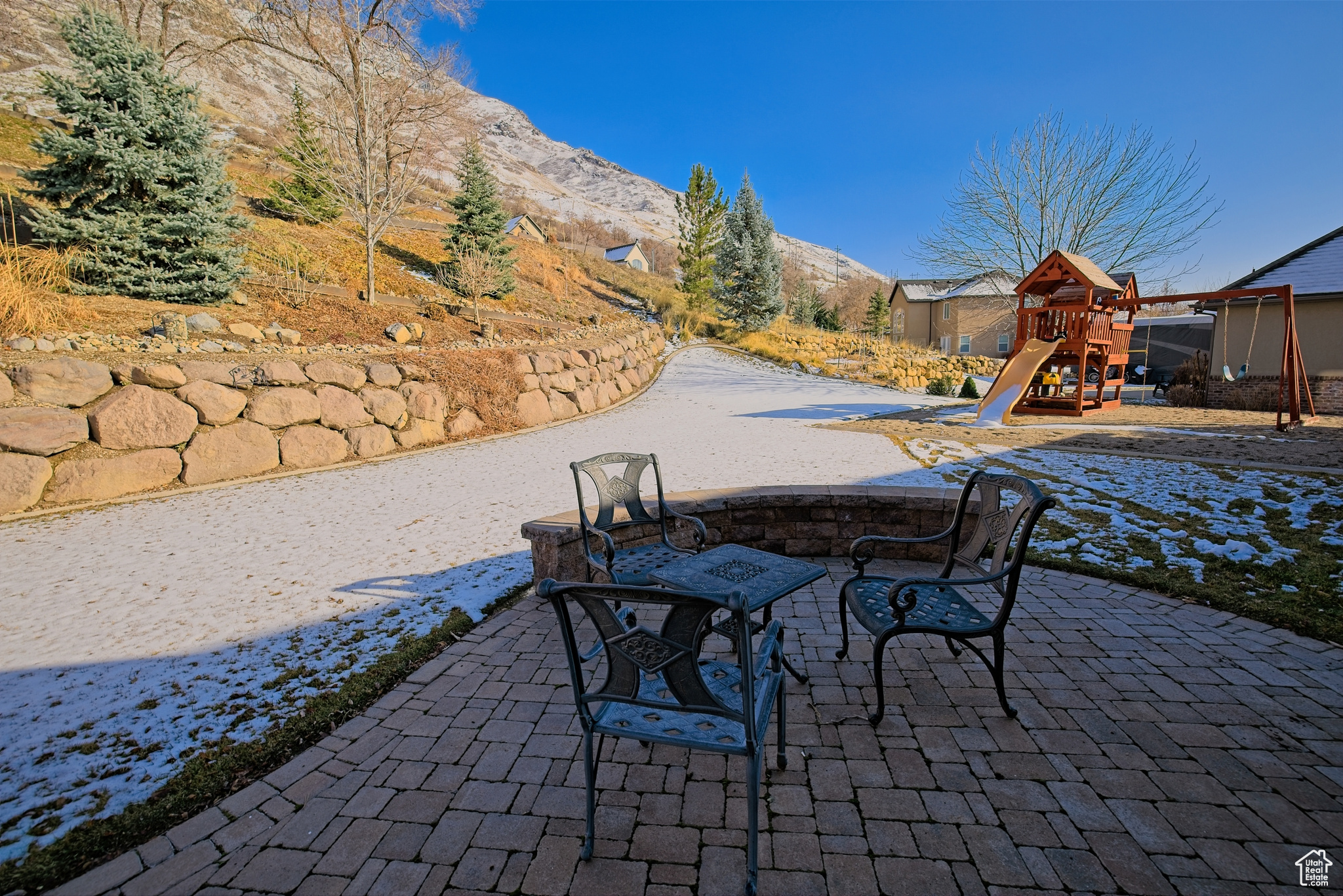 View of patio featuring a mountain view and a playground