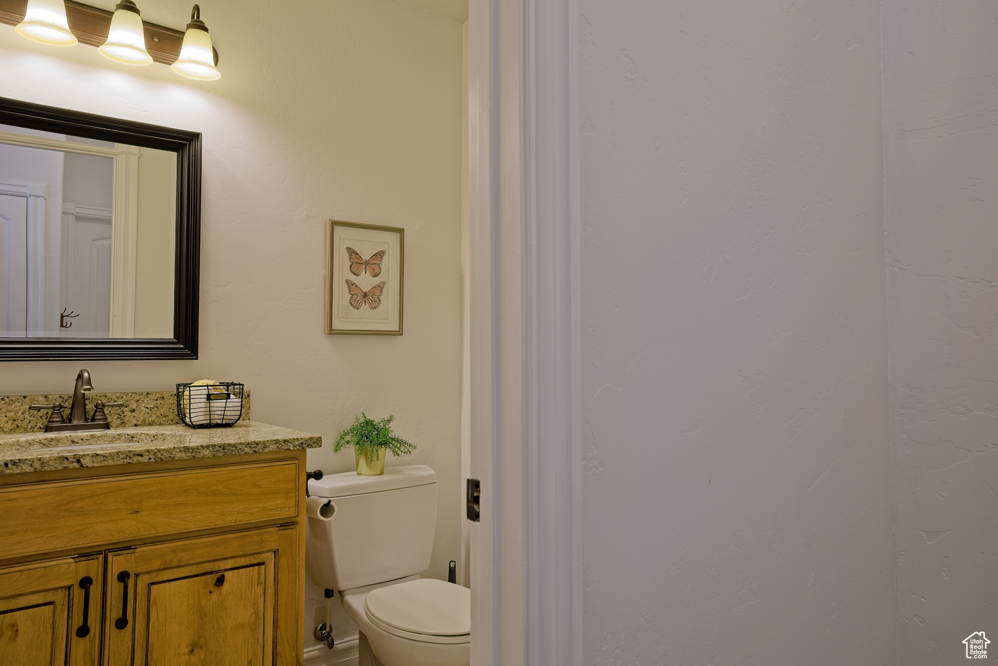 Half bath with toilet and vanity