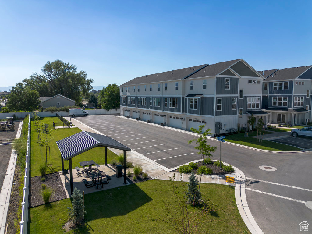 Uncovered parking lot with community garages and a residential view