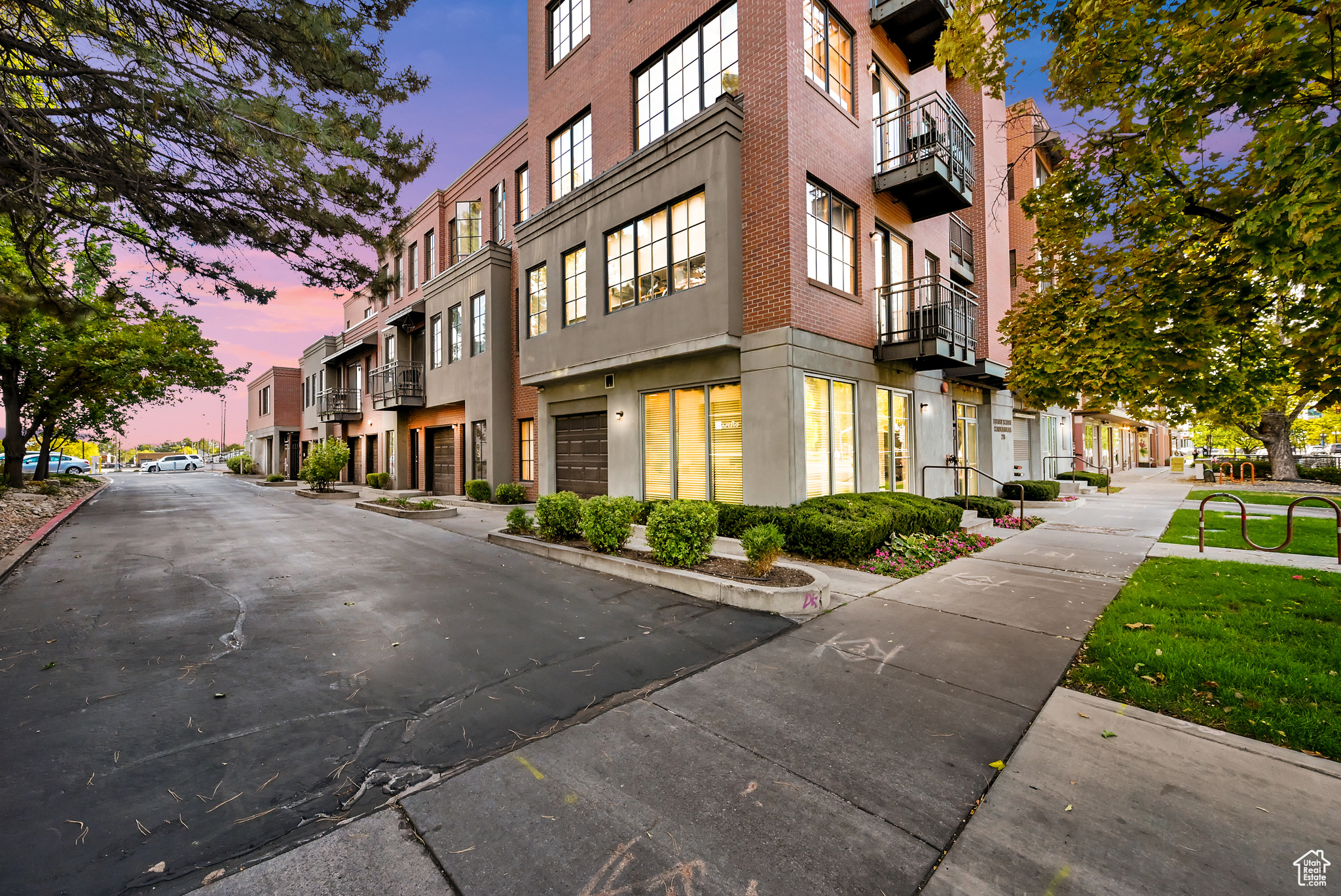 Property at dusk featuring a residential view