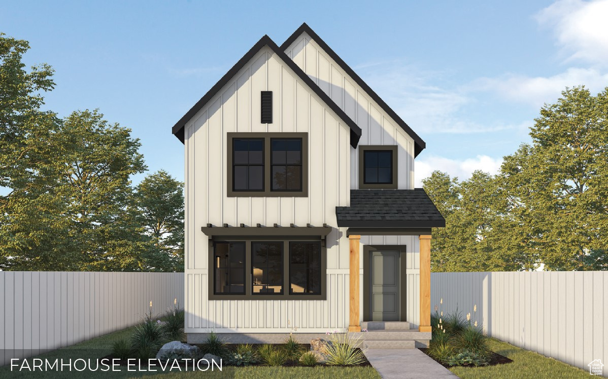 Modern inspired farmhouse featuring fence, board and batten siding, and a shingled roof
