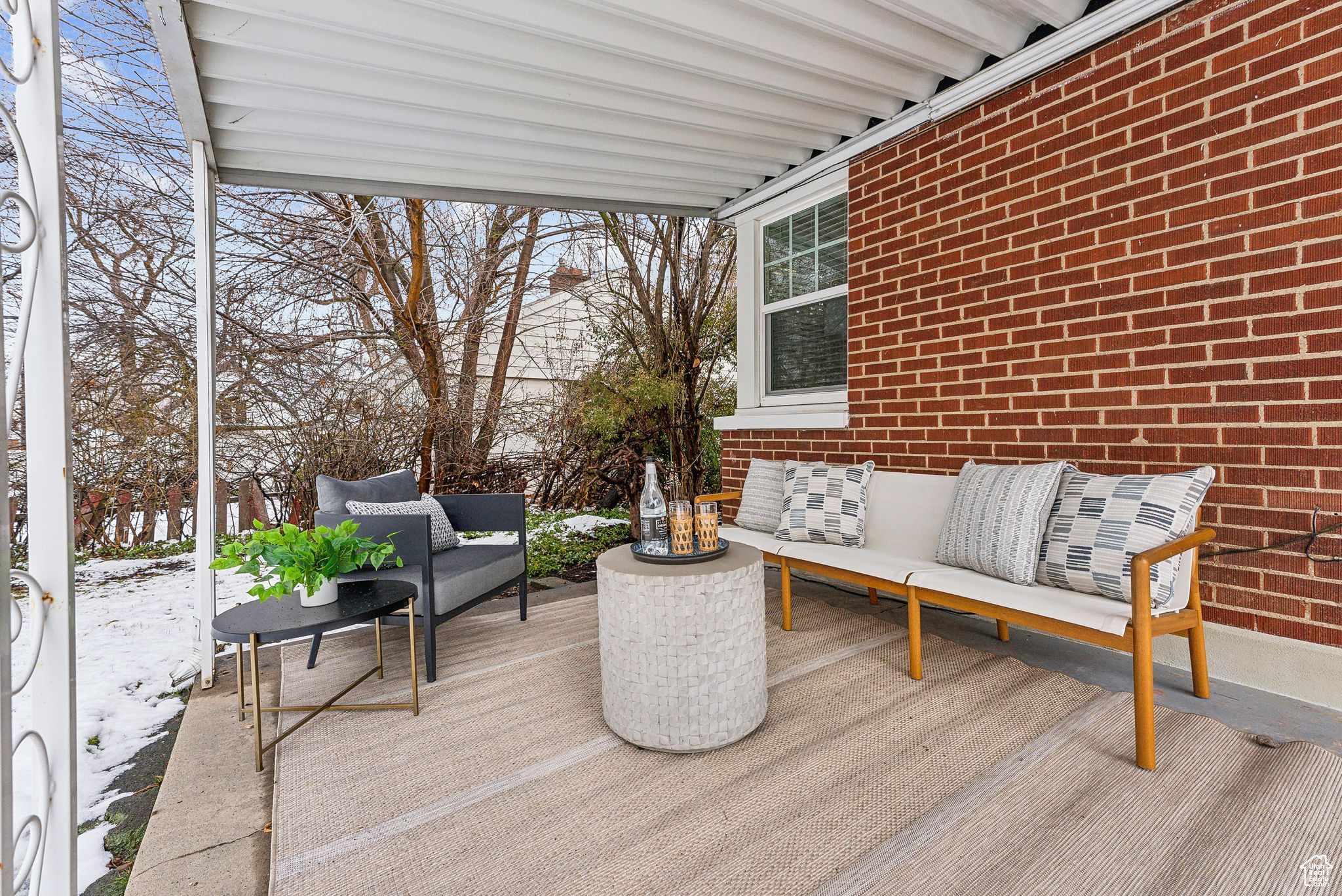 Covered patio featuring outdoor lounge area