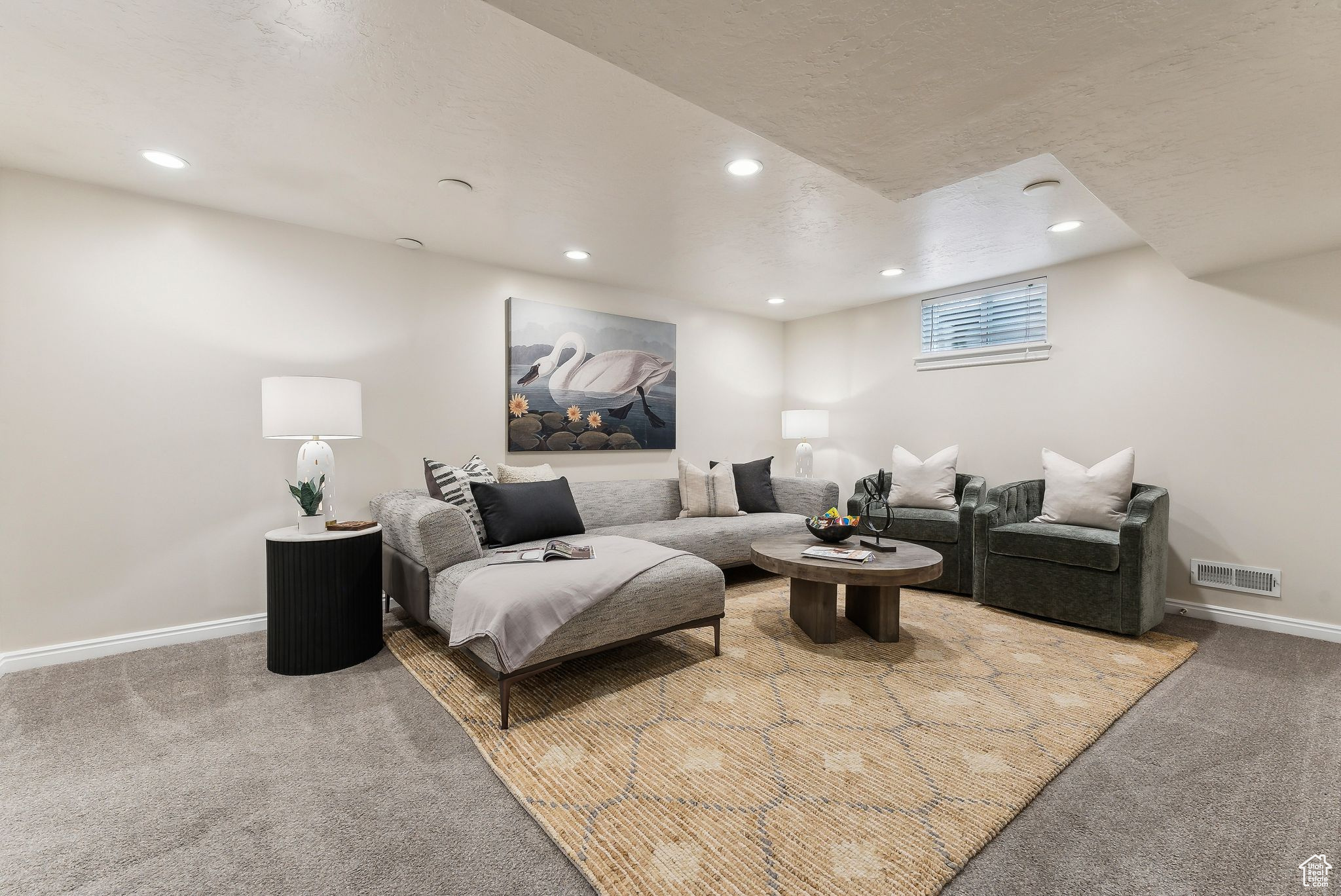 Living room with recessed lighting, baseboards, visible vents, and carpet floors