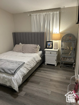 Bedroom featuring dark wood-type flooring