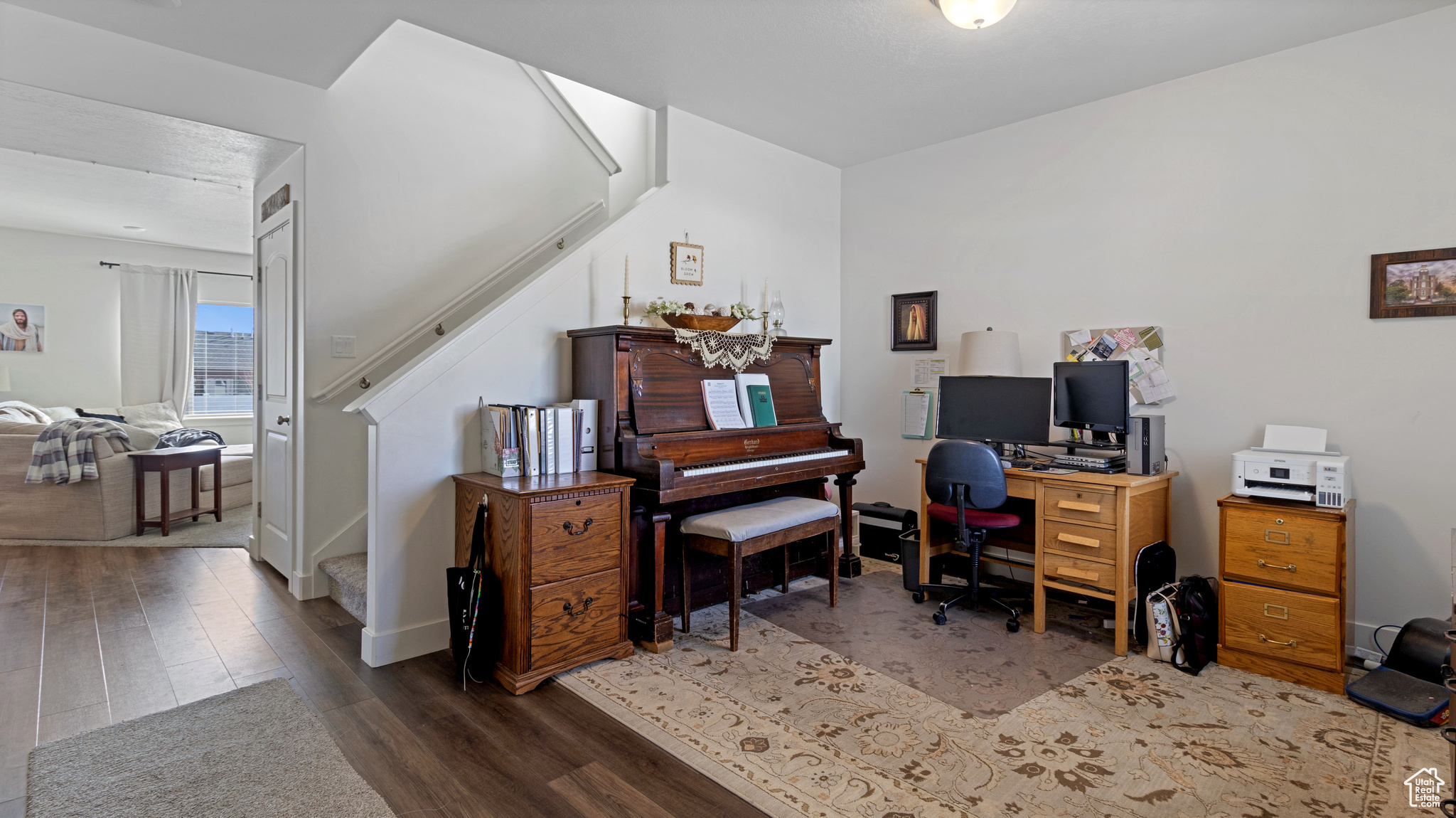 Office with wood finished floors and baseboards