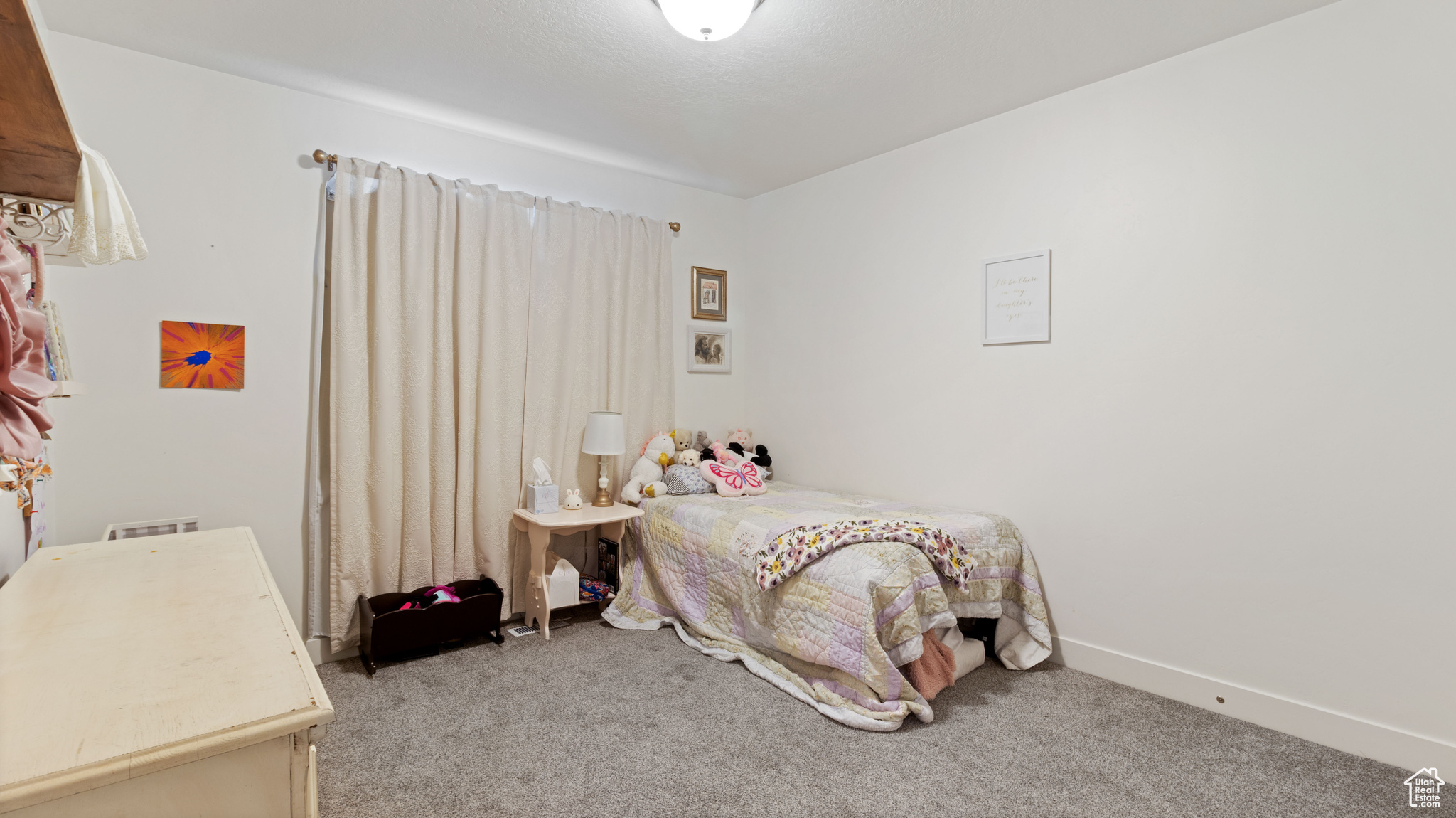 Carpeted bedroom with baseboards