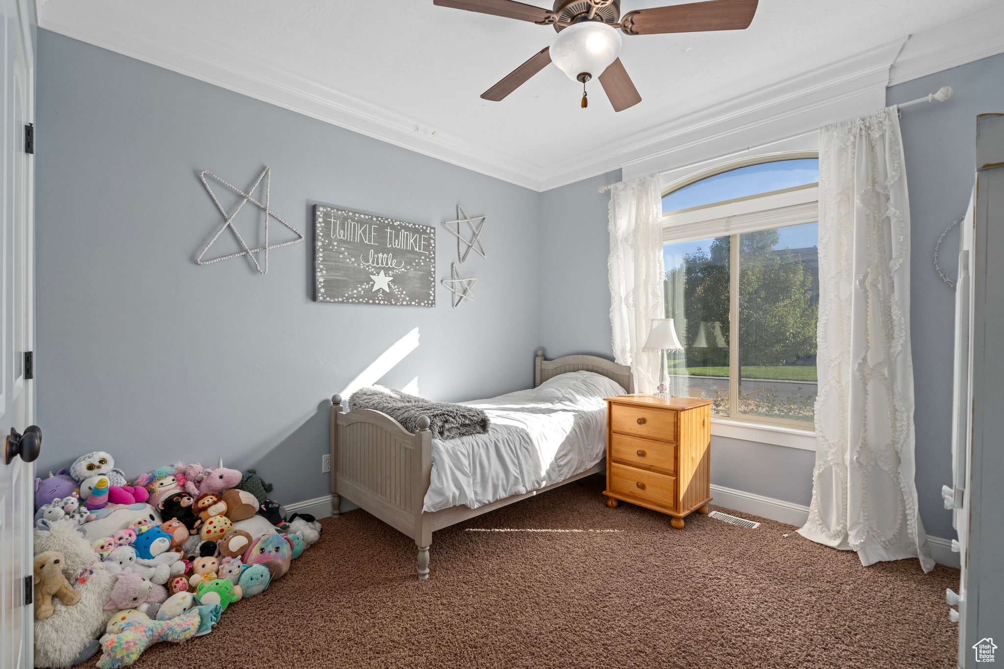 Bedroom featuring crown molding, carpet, baseboards, and ceiling fan