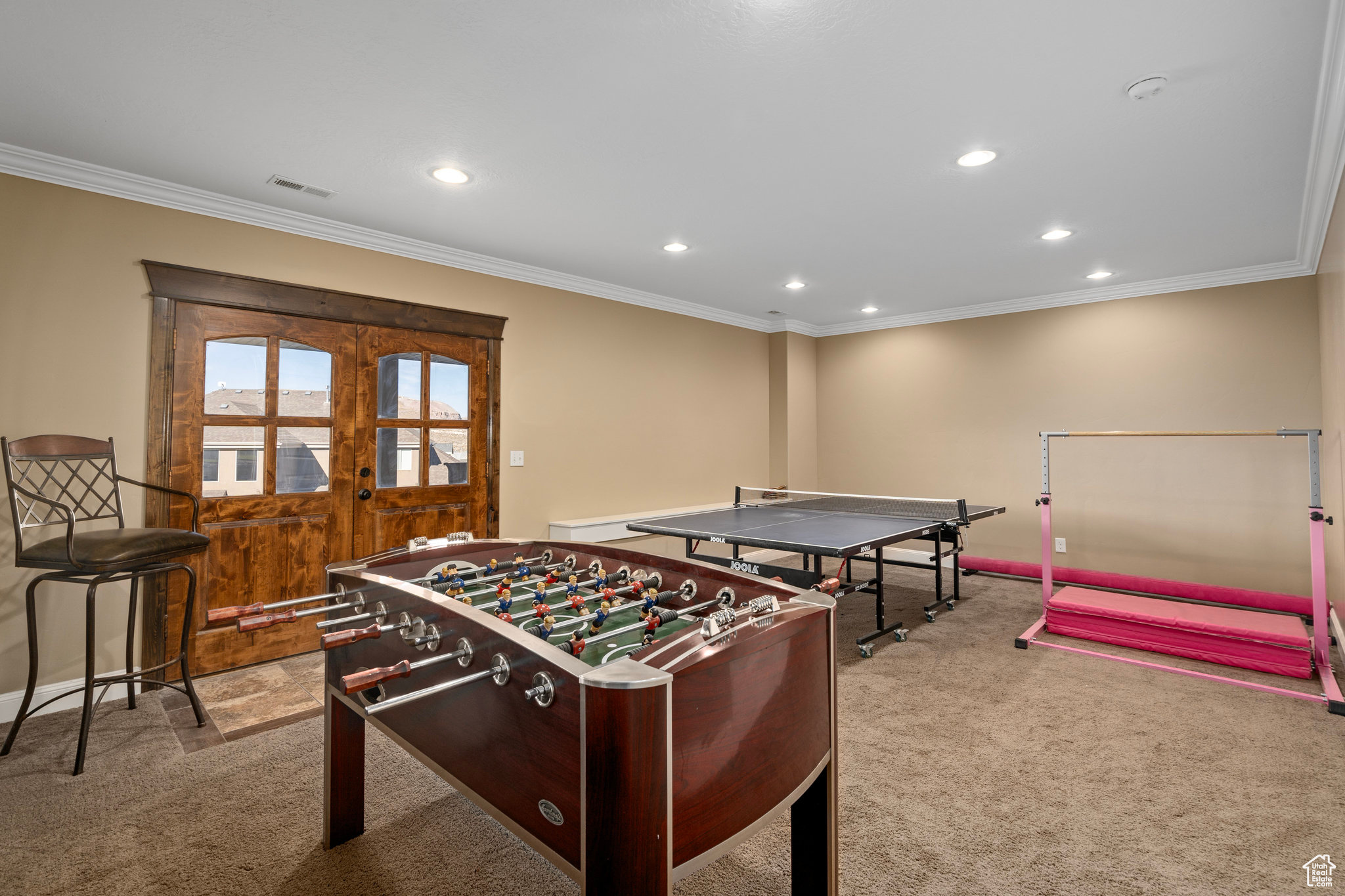 Game room featuring visible vents, ornamental molding, carpet flooring, recessed lighting, and french doors