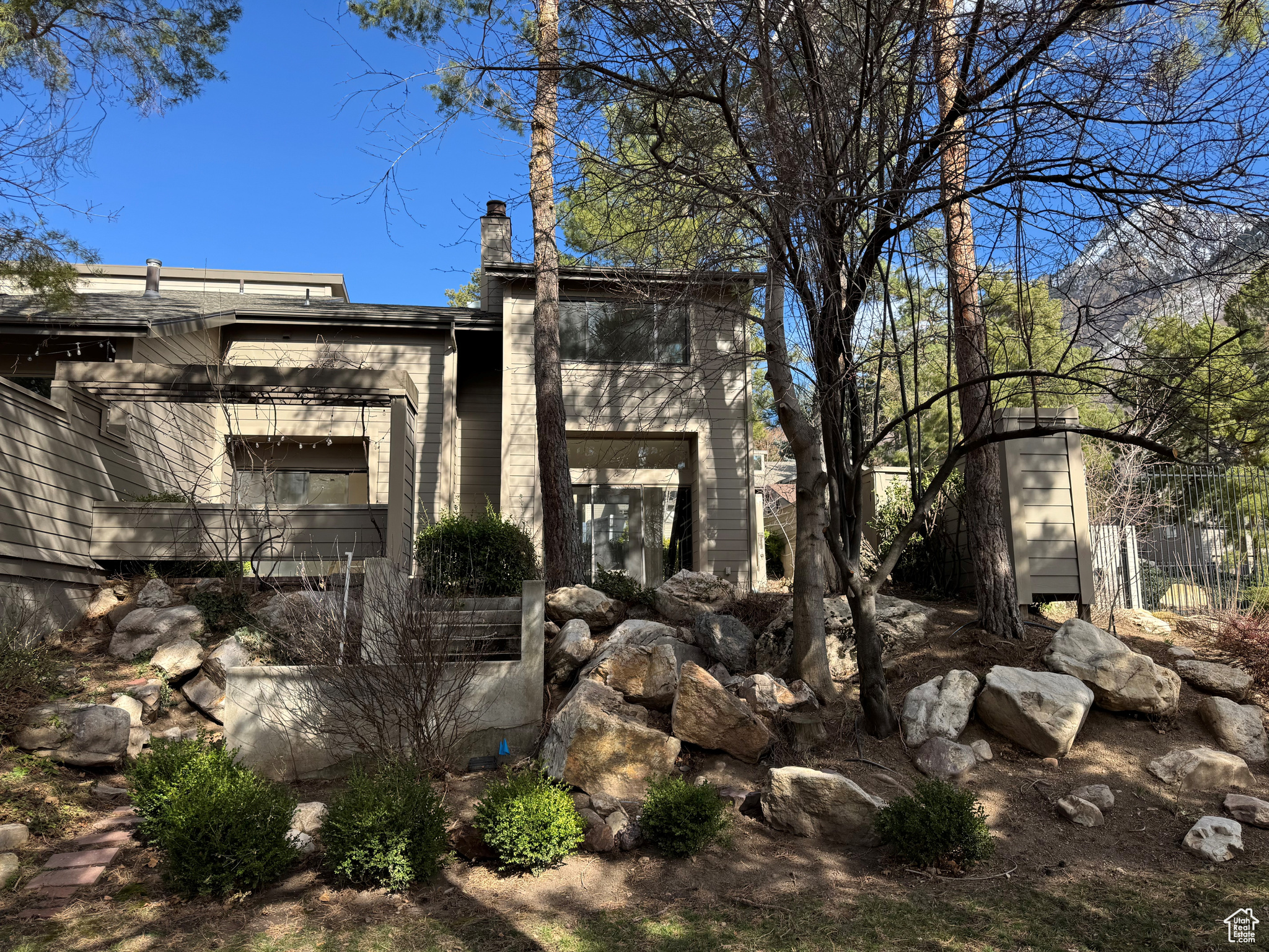 View of side of property with fence