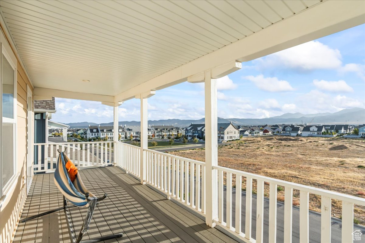 Deck featuring a residential view and a mountain view