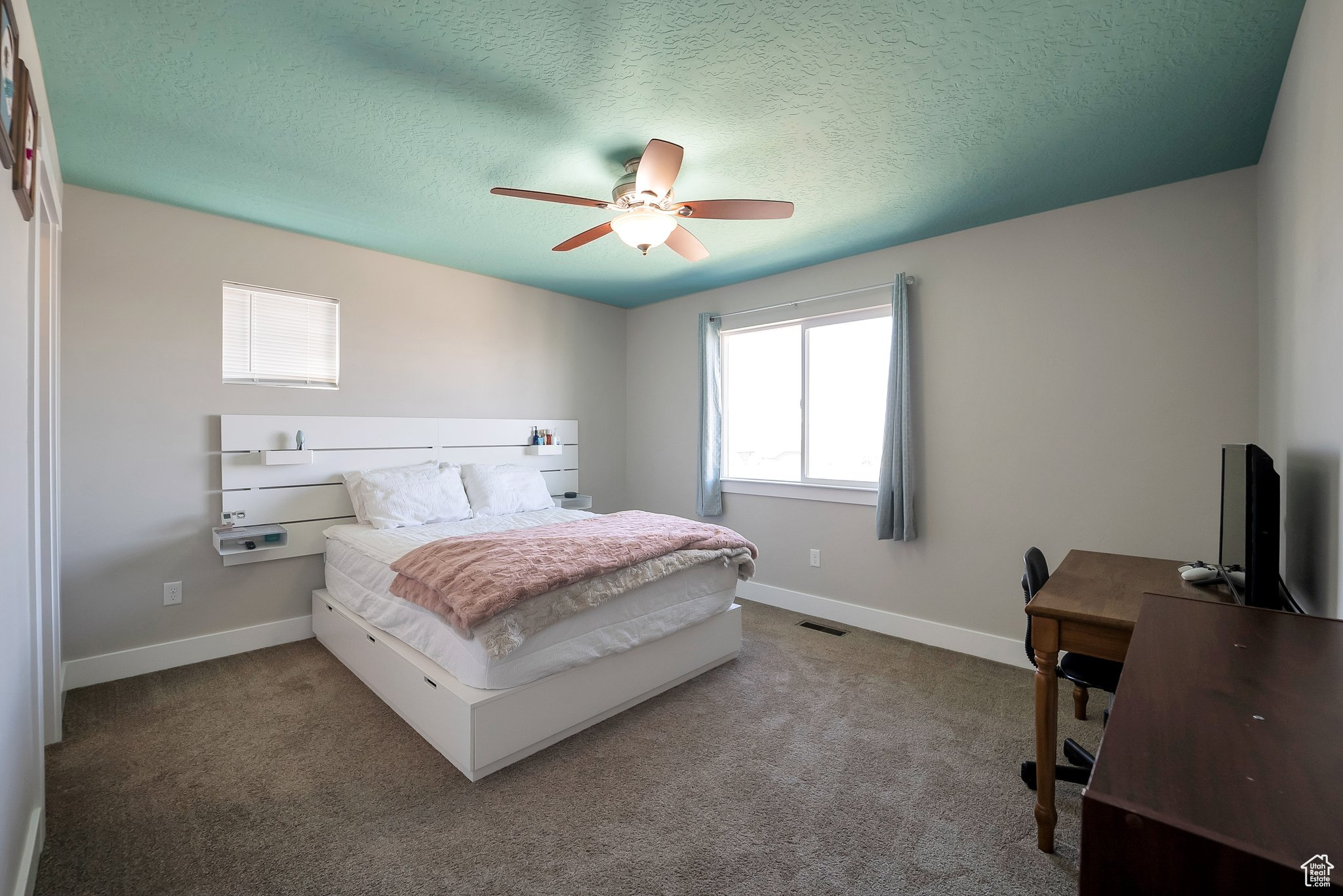 Bedroom featuring visible vents, baseboards, and carpet