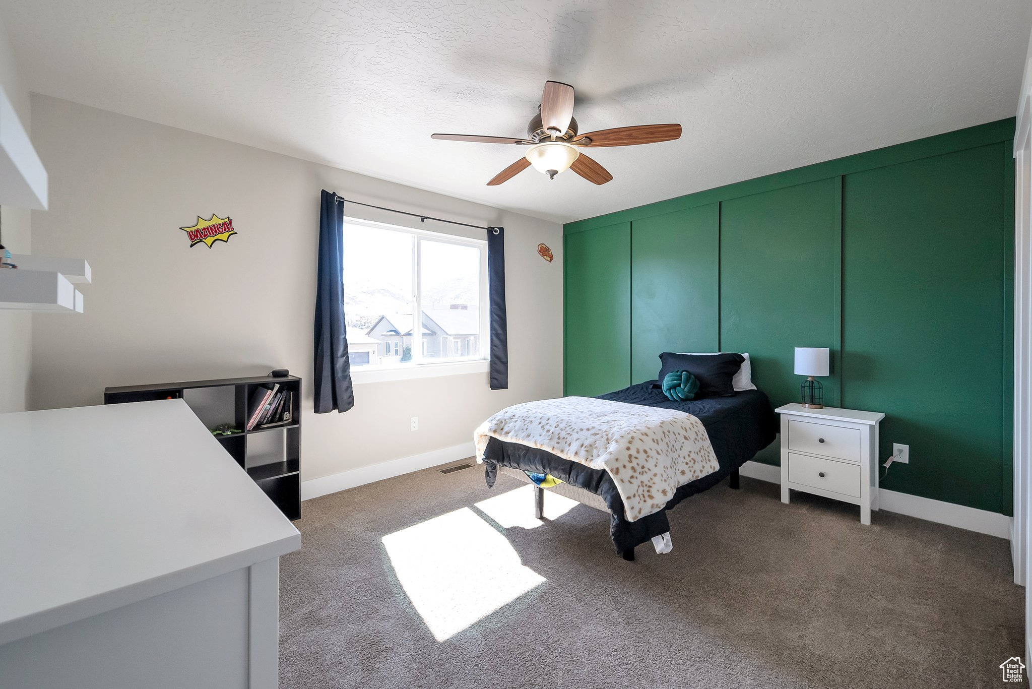 Bedroom featuring baseboards, visible vents, carpet floors, and a textured ceiling