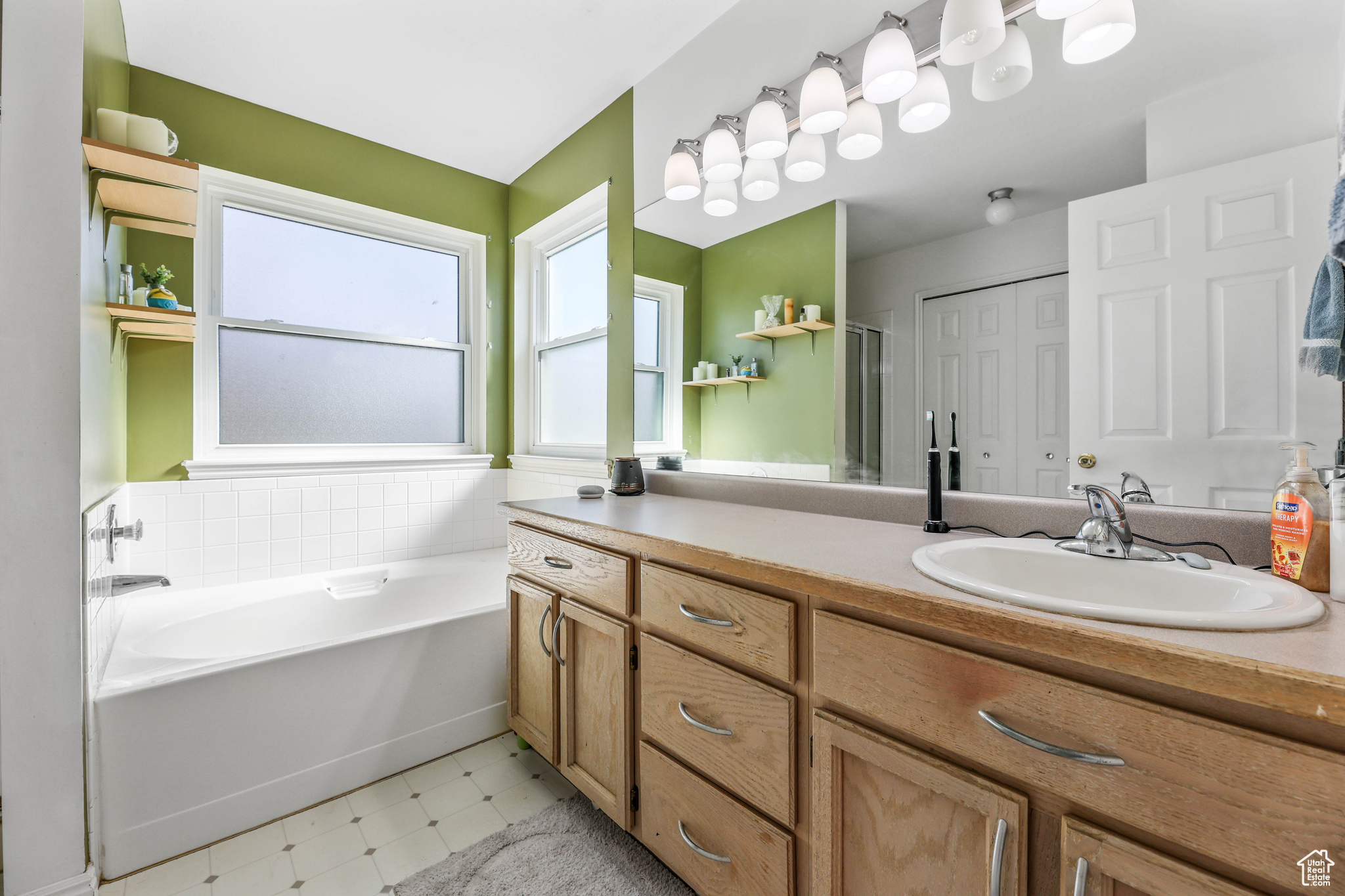 Great primary bathroom with separate tub and shower.