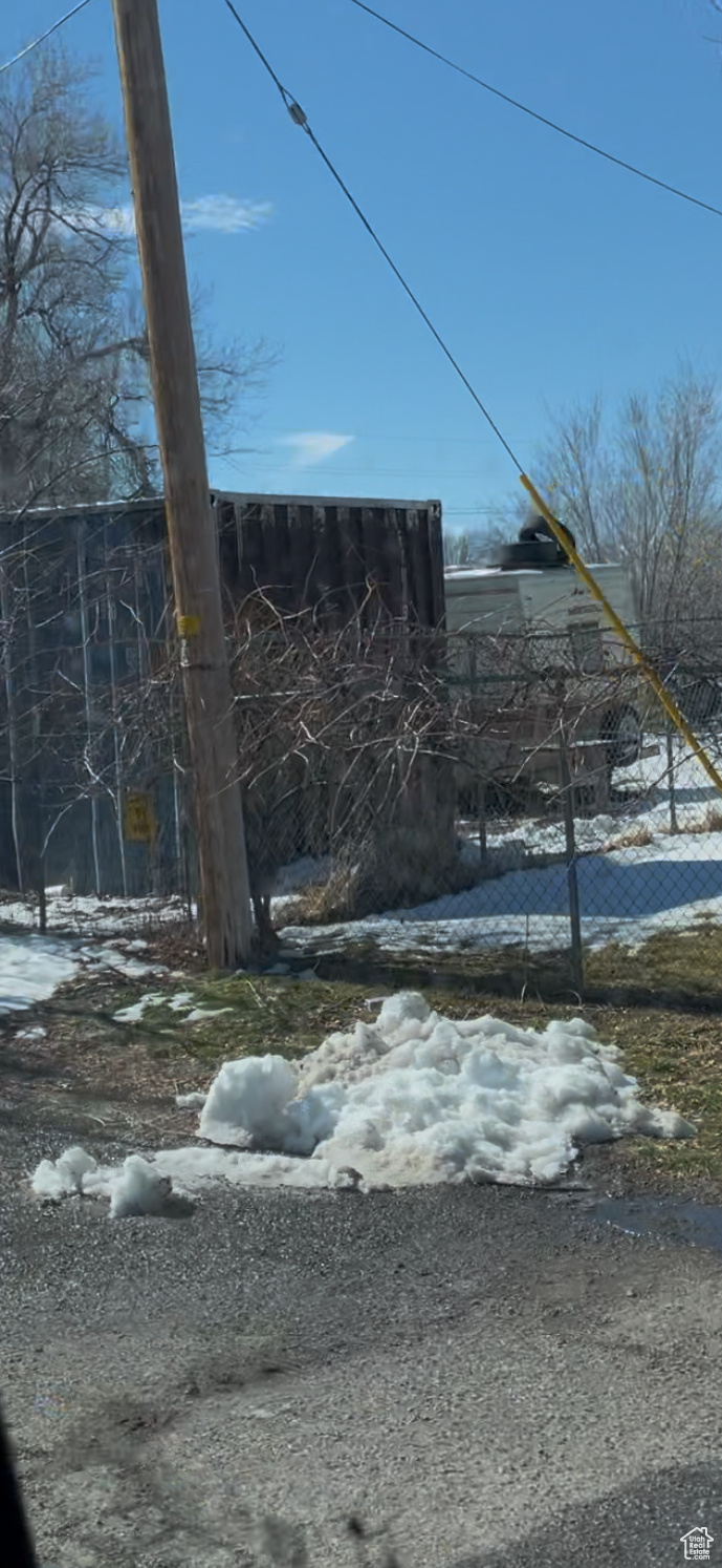 View of yard layered in snow