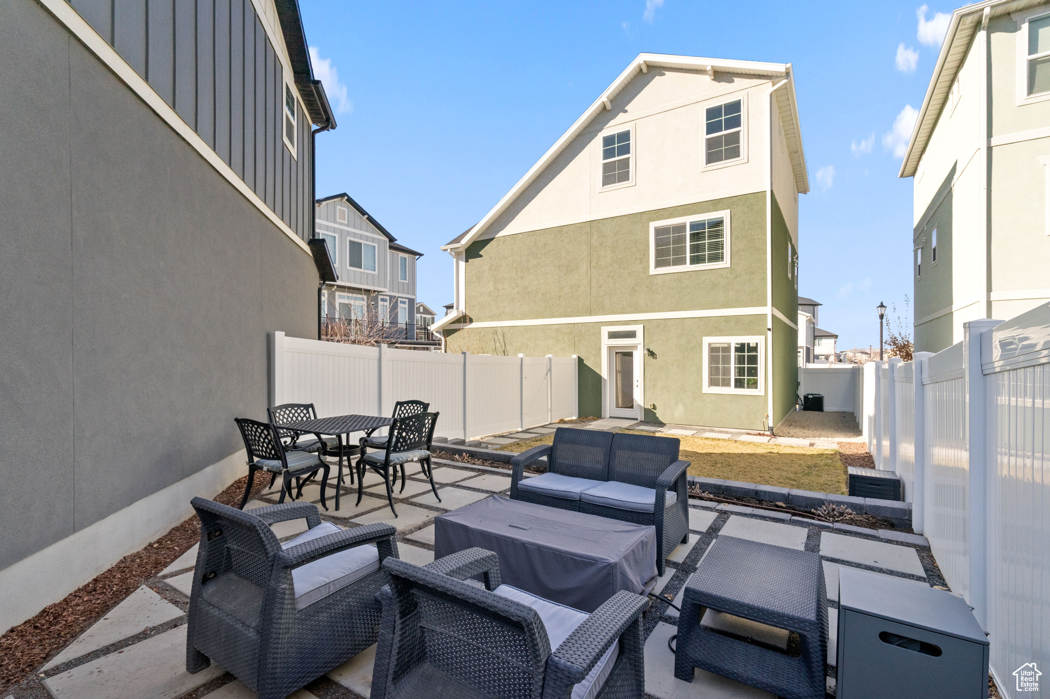 View of patio with outdoor lounge area, outdoor dining area, and a fenced backyard