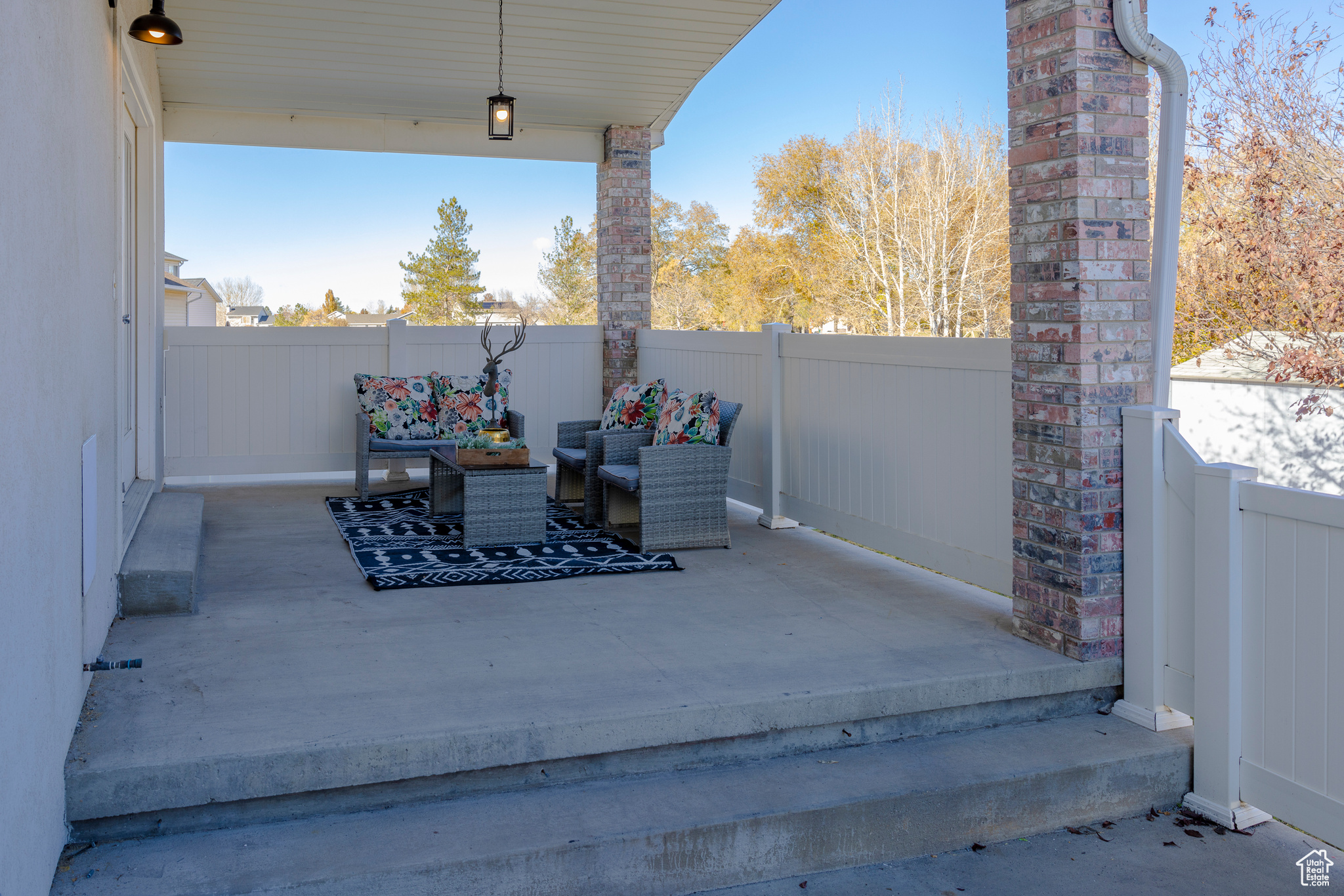 View of patio with a fenced backyard