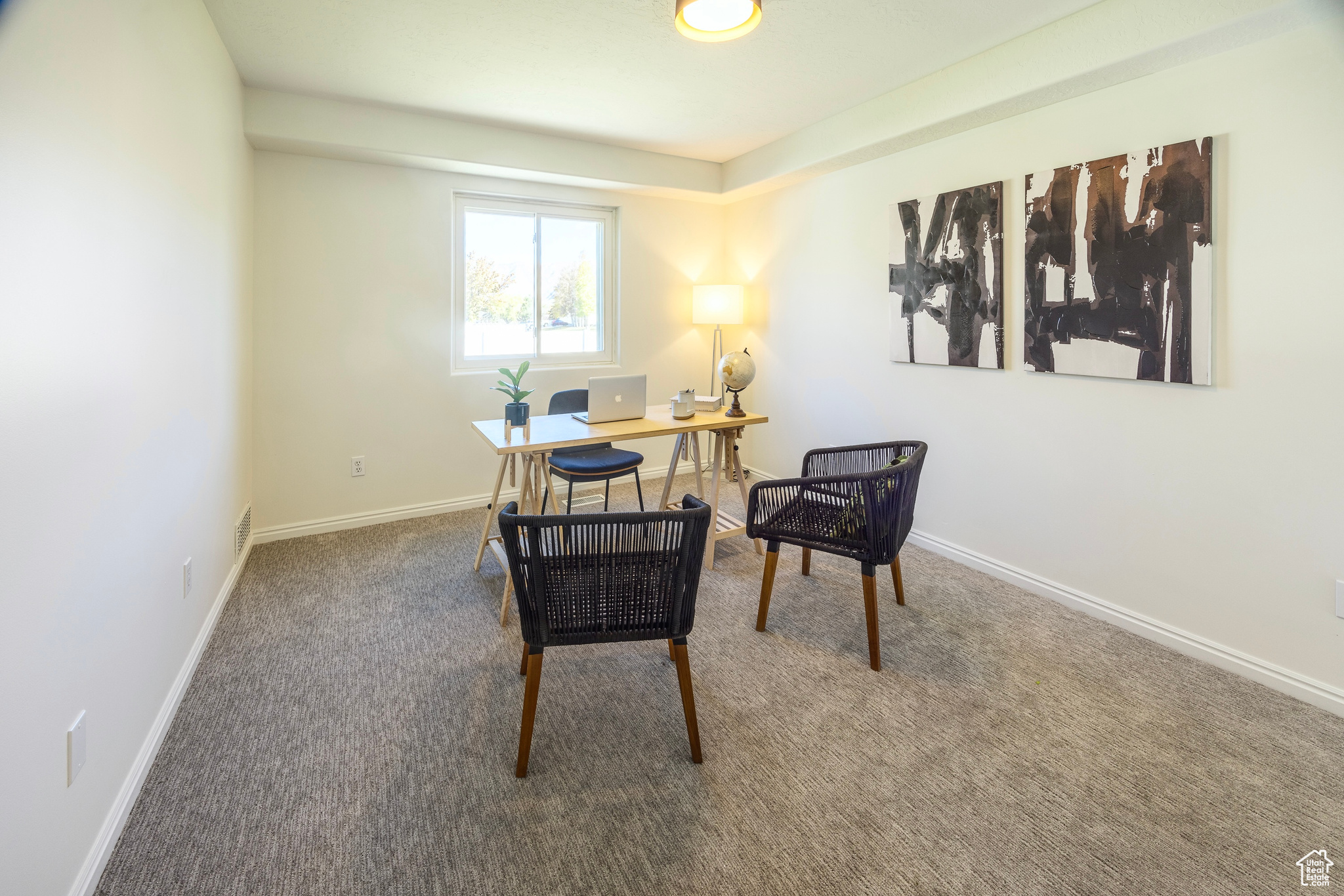 Office space featuring carpet and baseboards